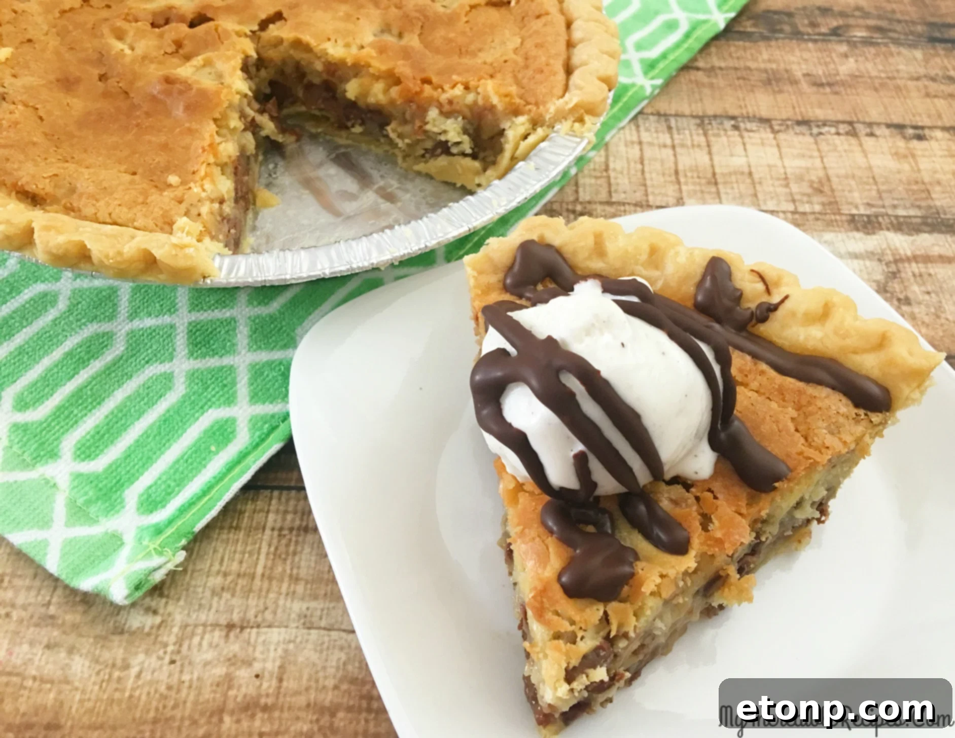 A plate with a half-eaten slice of chocolate chip pie, emphasizing its irresistible nature