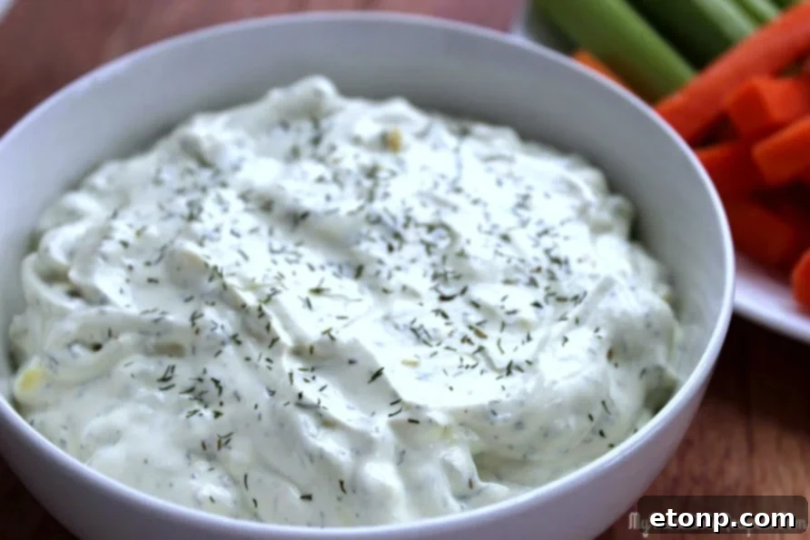 Tangy Dill Pickle Dip 2 Delicious Creamy Dill Pickle Dip served with chips and vegetables