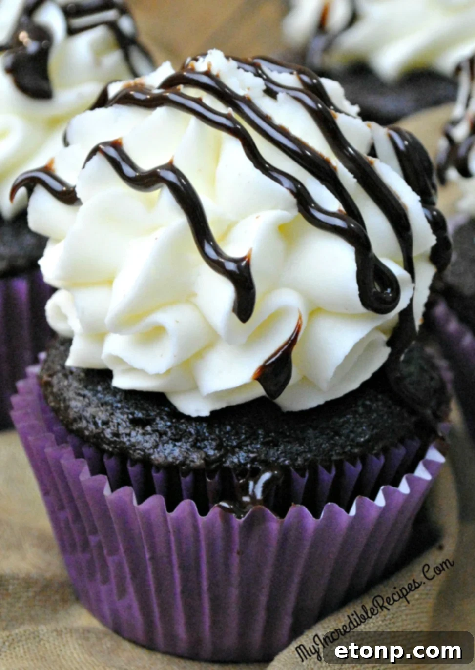 Decadent Kahlua Chocolate Cupcakes 2 Rich, moist chocolate Kahlúa cupcake with creamy frosting and chocolate drizzle, perfect for an indulgent dessert.