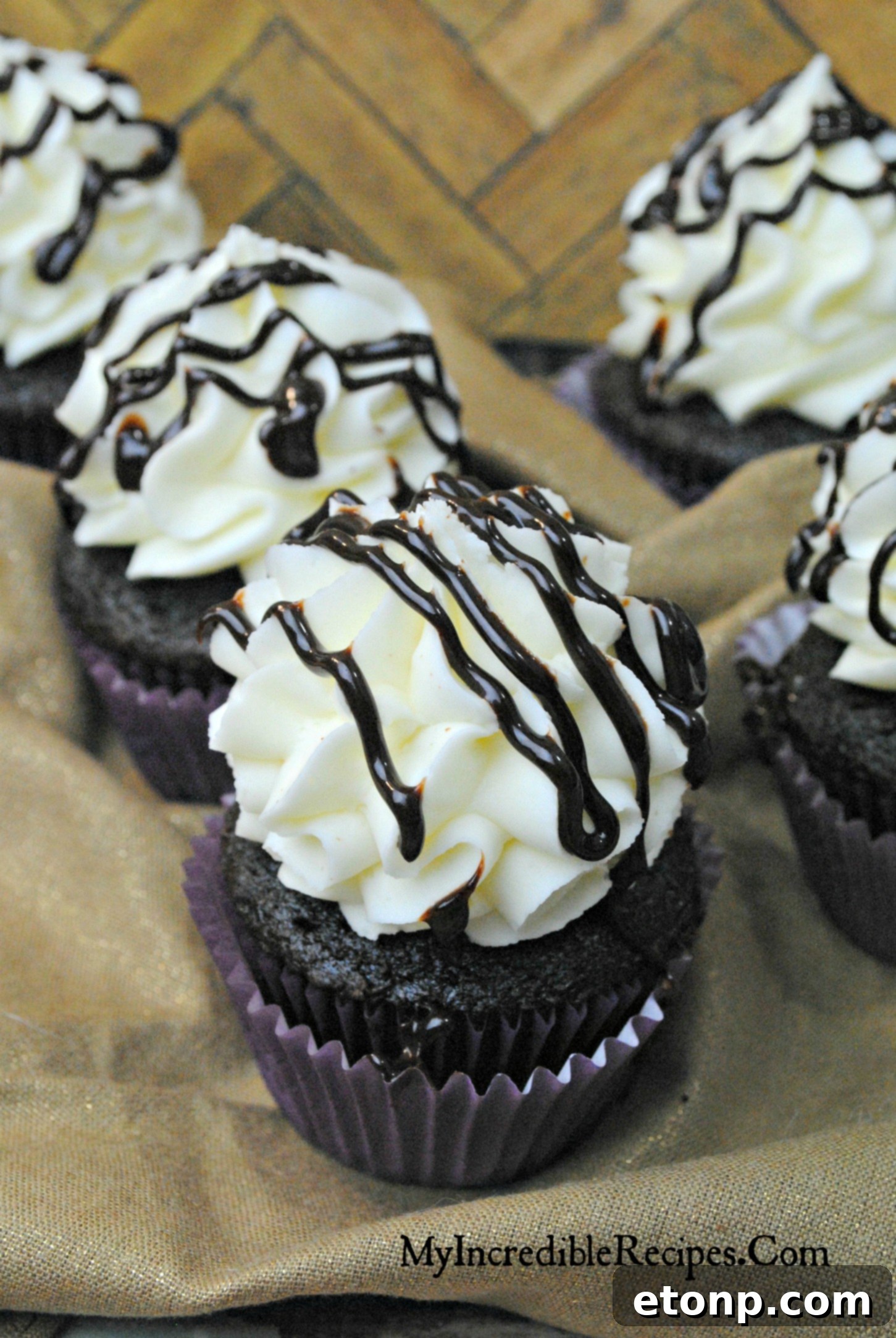 Decadent Kahlua Chocolate Cupcakes 5 Three beautifully frosted chocolate Kahlúa cupcakes ready to be served at a gathering or cookout.