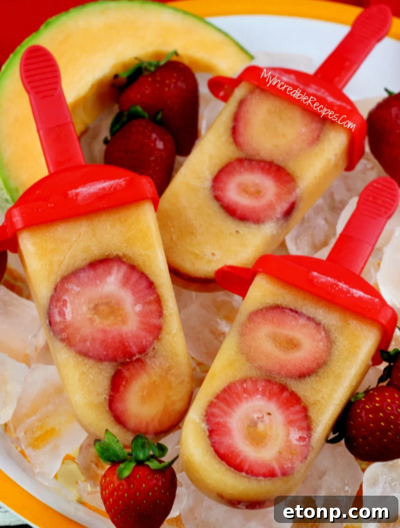 Delicious Strawberry Cantaloupe Popsicles ready to be enjoyed, showcasing vibrant colors