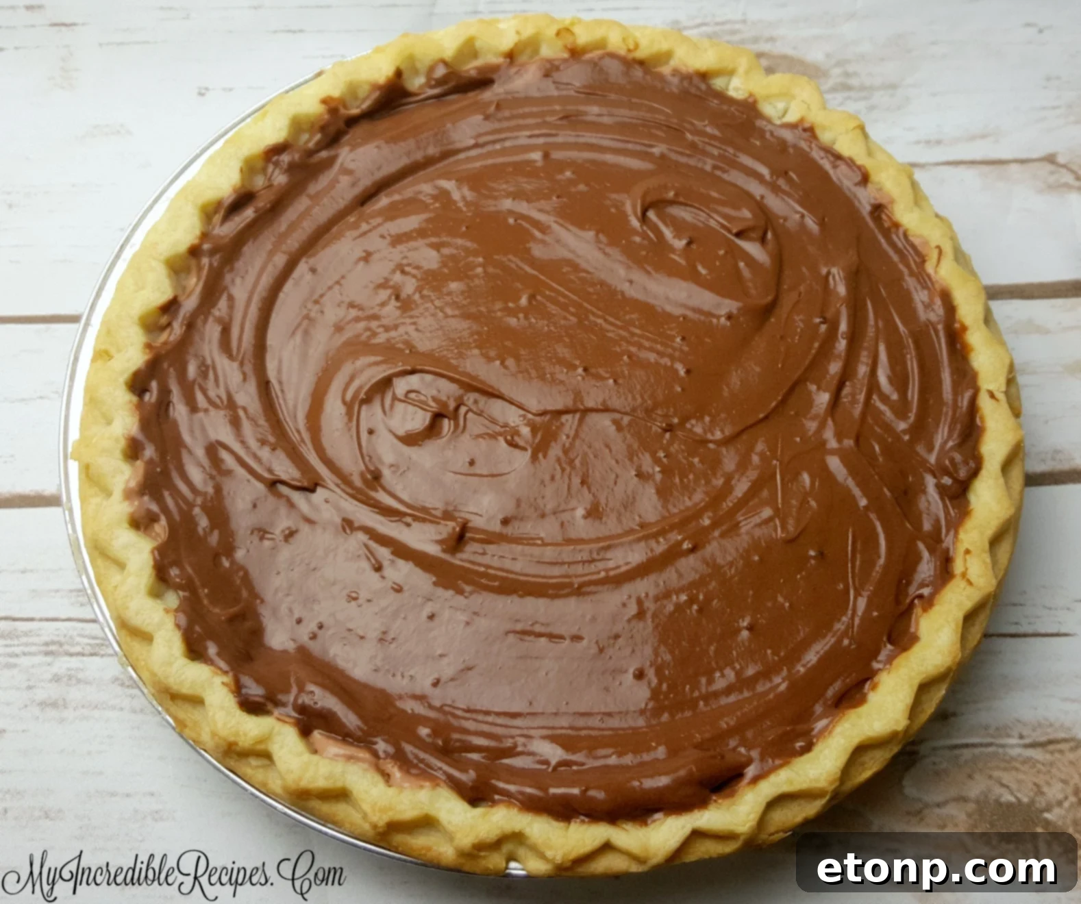 Chocolate cream pie with a slice removed