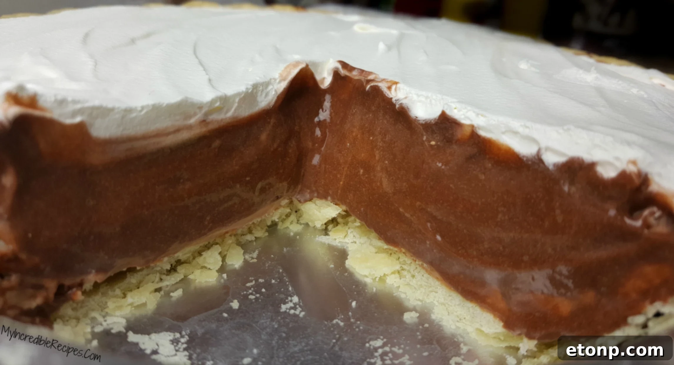 Slice of chocolate cream pie on a vintage plate