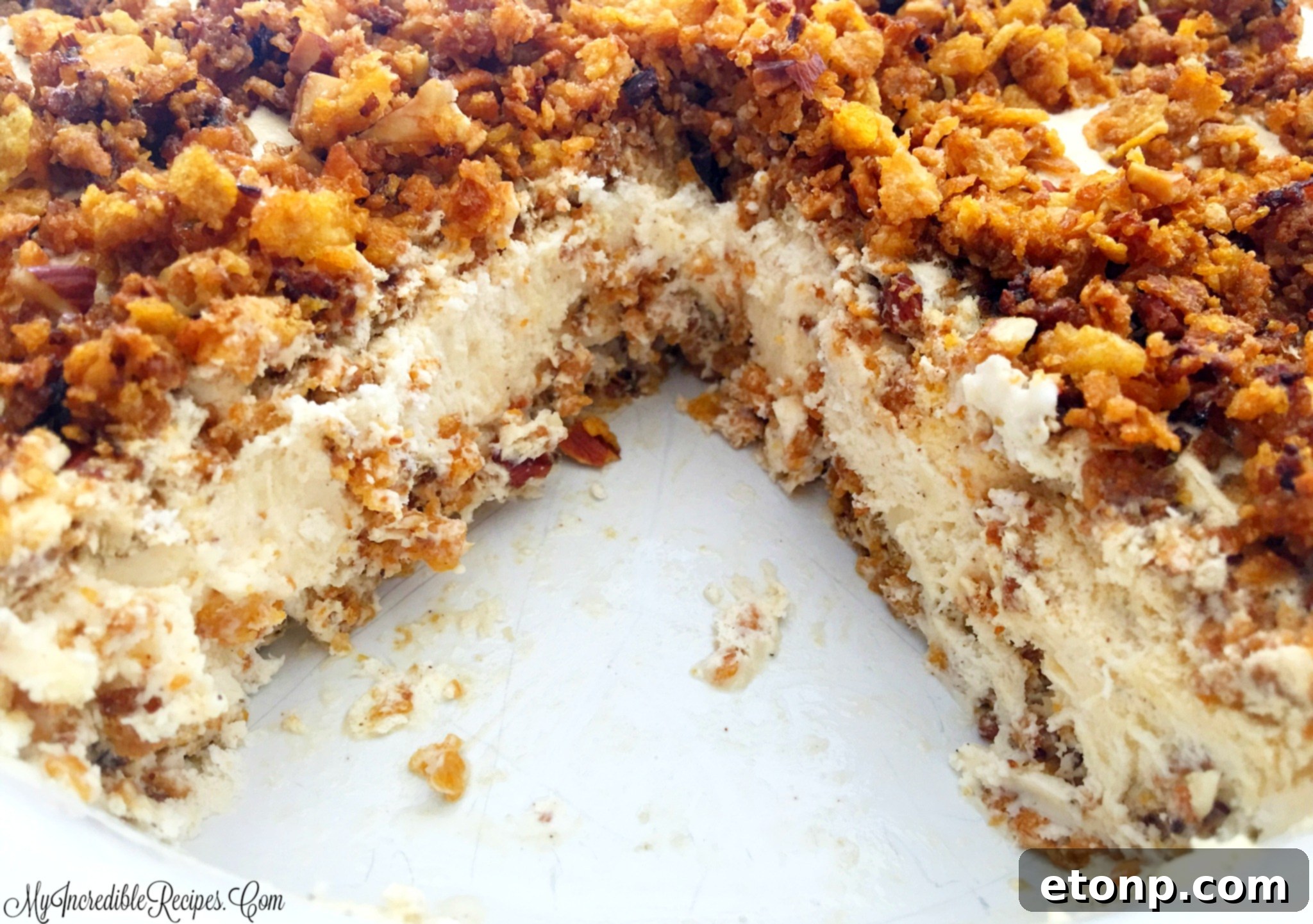 A perfectly portioned slice of no-bake fried ice cream pie, showing the crust, filling, and topping.