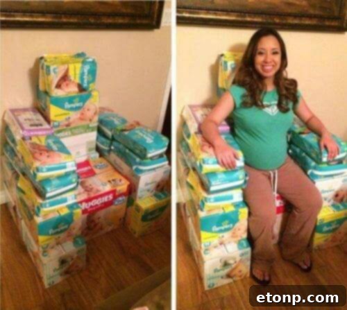 Elaborate diaper throne constructed for an expecting mother at a baby shower, decorated with ribbons and baby items.