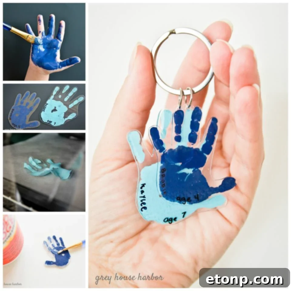 Close-up of a small, round wooden keychain featuring a child's handprint impression, symbolizing a cherished memory.