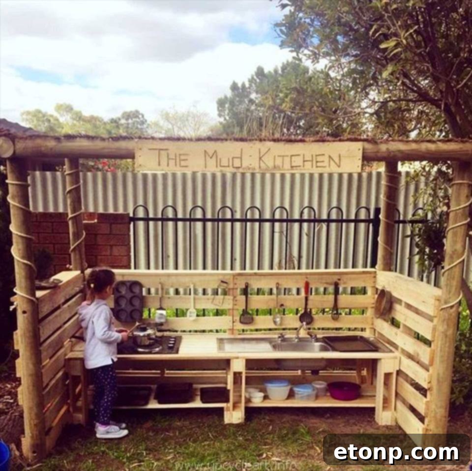 Craft Your Dream Home with Pallet DIY 17 Engaging DIY Pallet Mud Kitchen for Kids, encouraging outdoor play