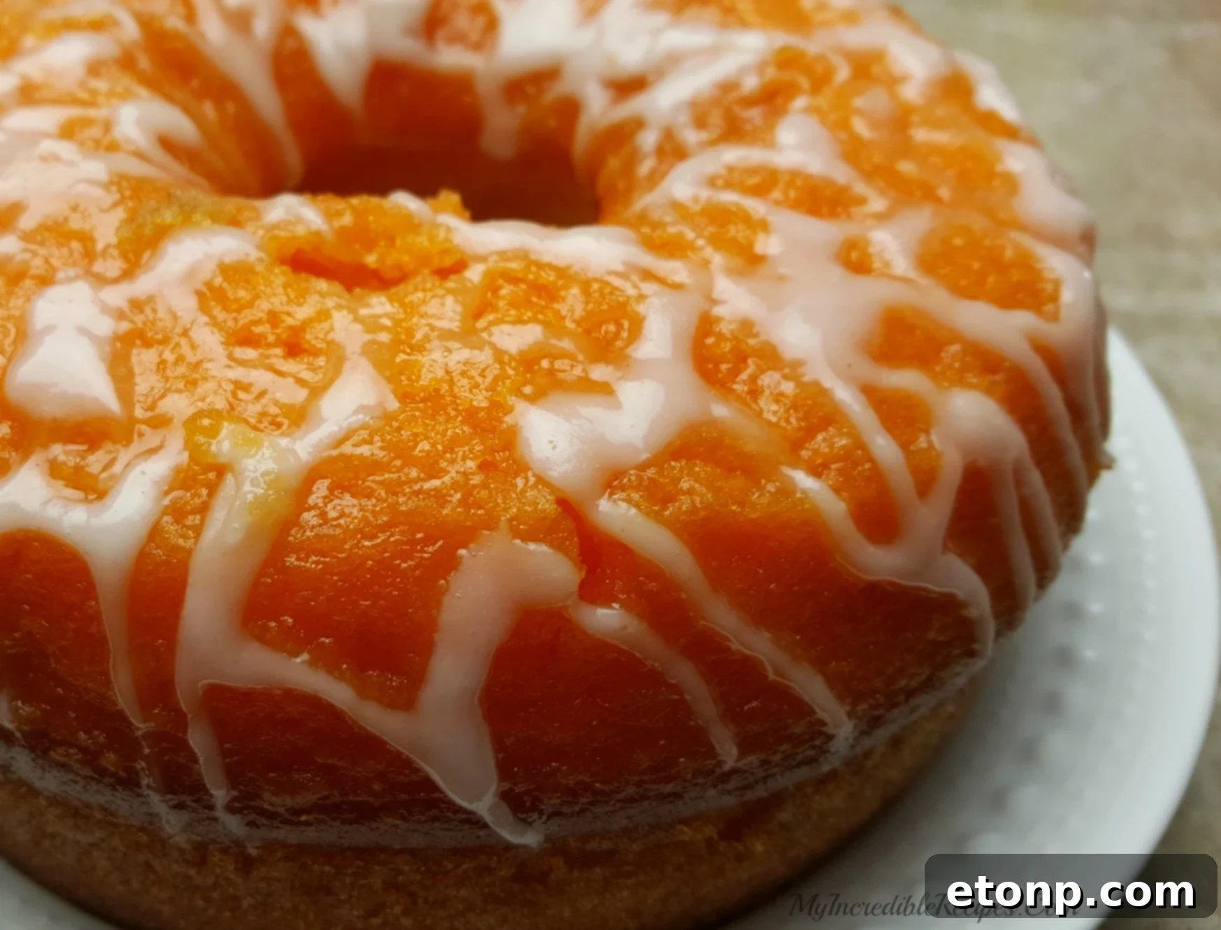 Fresh orange zest being added to cake batter