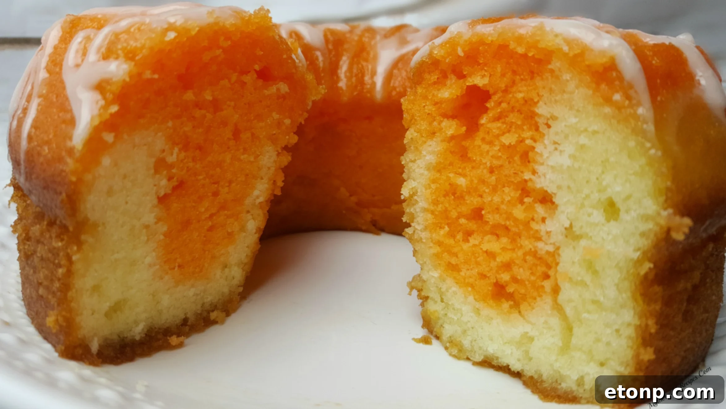 Orange Creamsicle Cake with a scoop of vanilla ice cream