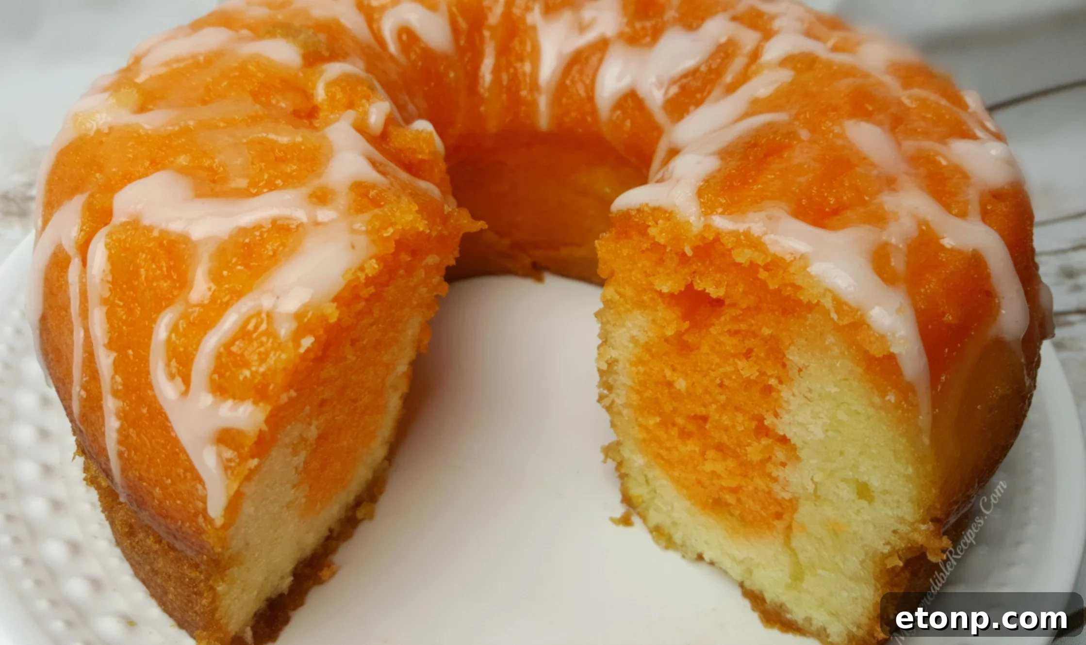Serving slice of Orange Creamsicle Cake