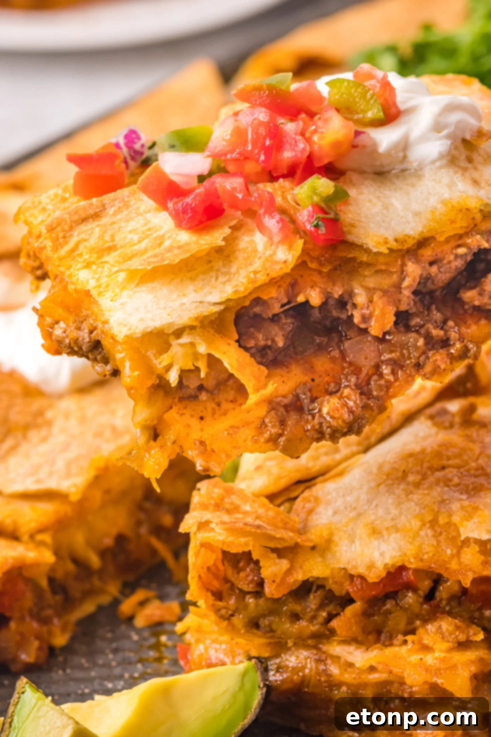 A piece of sheet pan taco being removed from the baking sheet. 