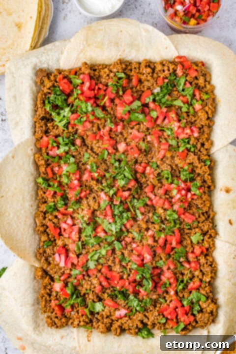 Sheet pan tacos cooking in the oven.