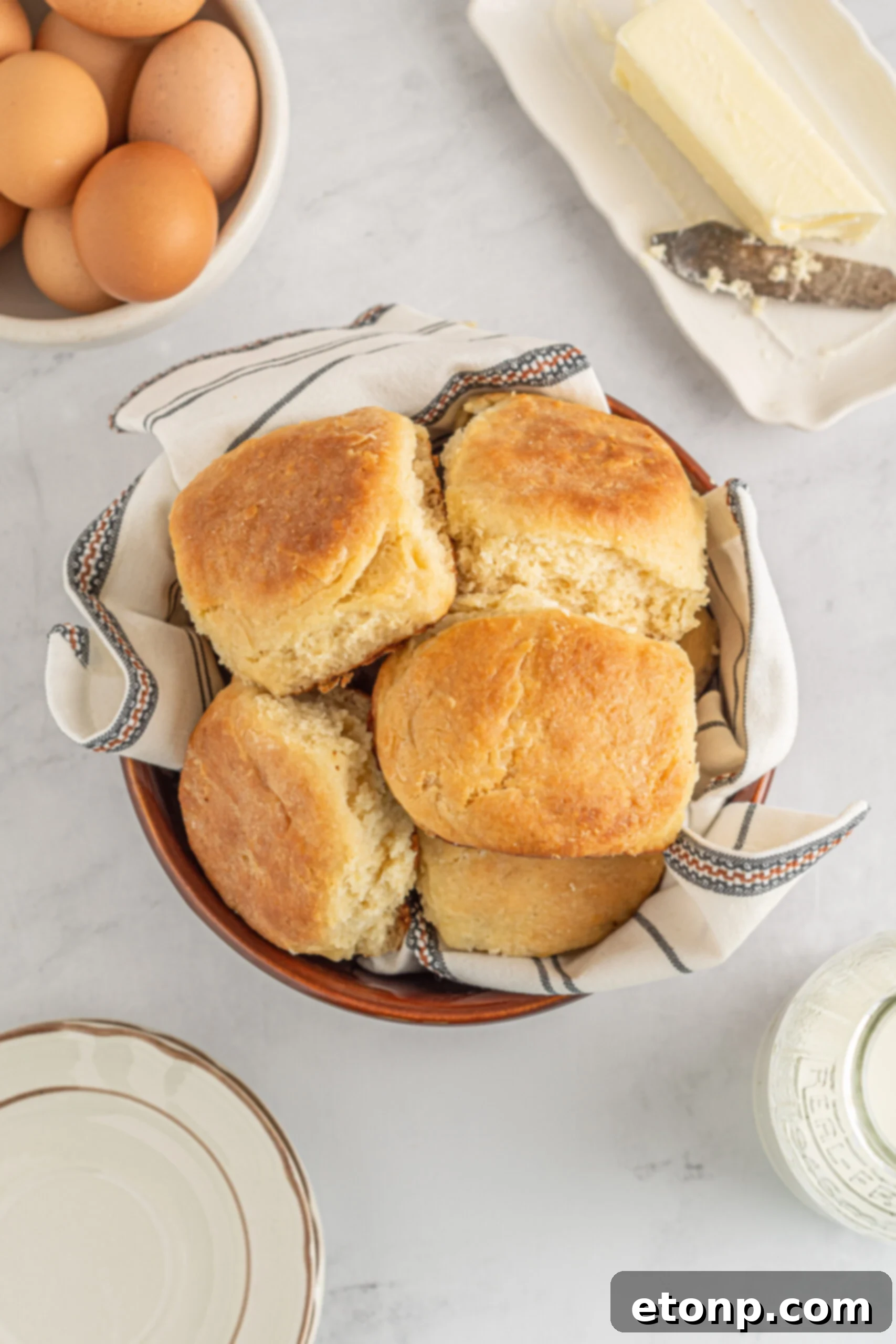 Angel Biscuits in a brown bowl with a white and black linen. 