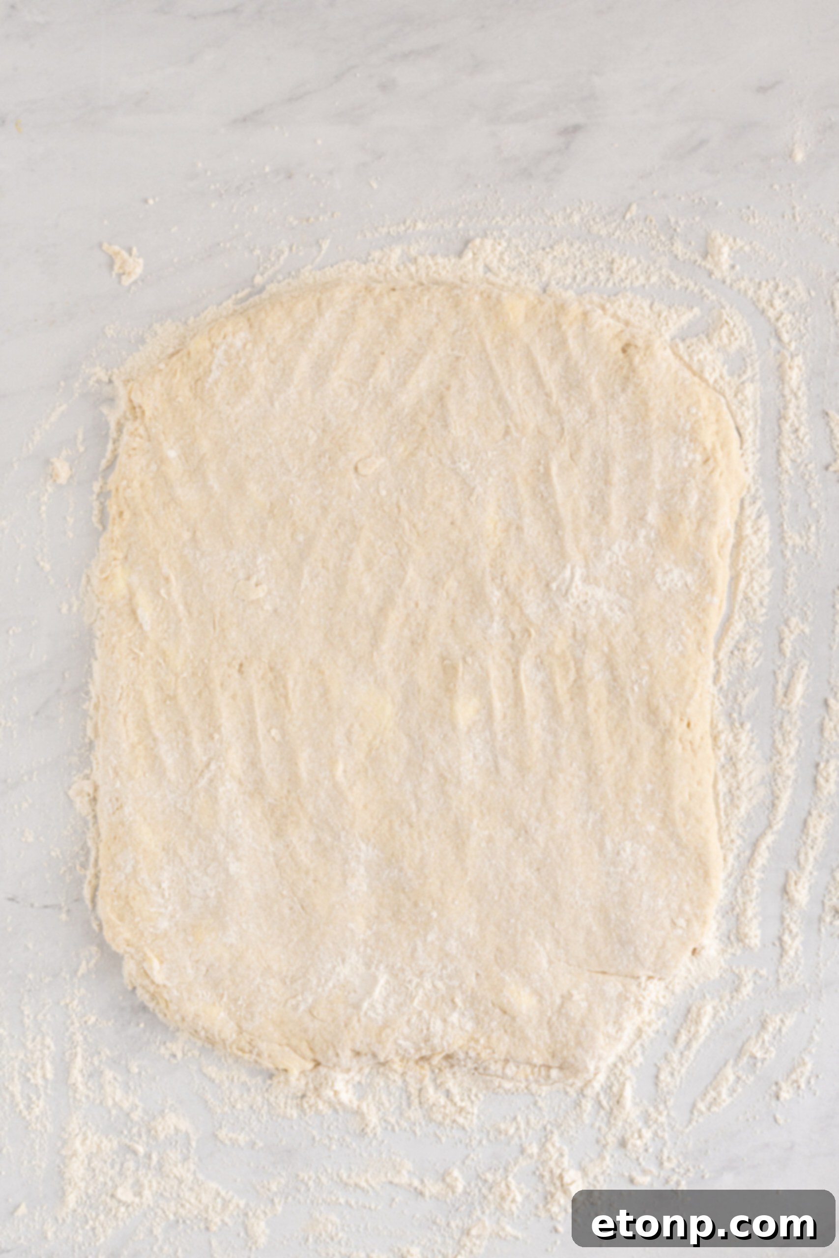Overhead shot of the dough rolled out ready to be cut. 