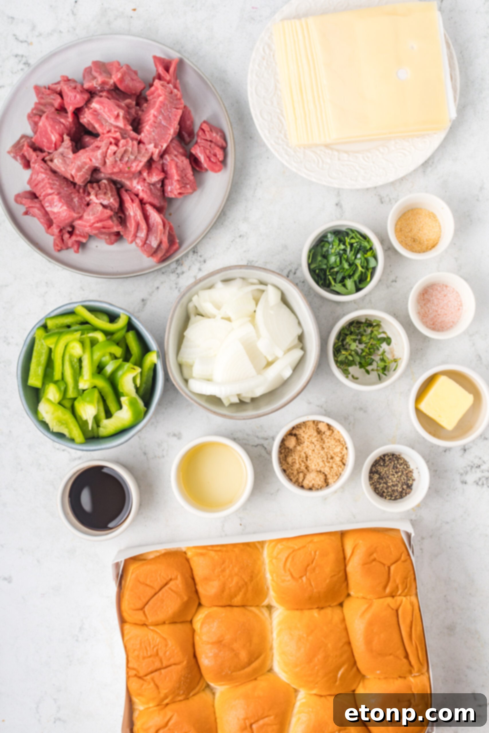 Overhead shot of ingredients needed to make Philly Cheesesteak Sliders. 