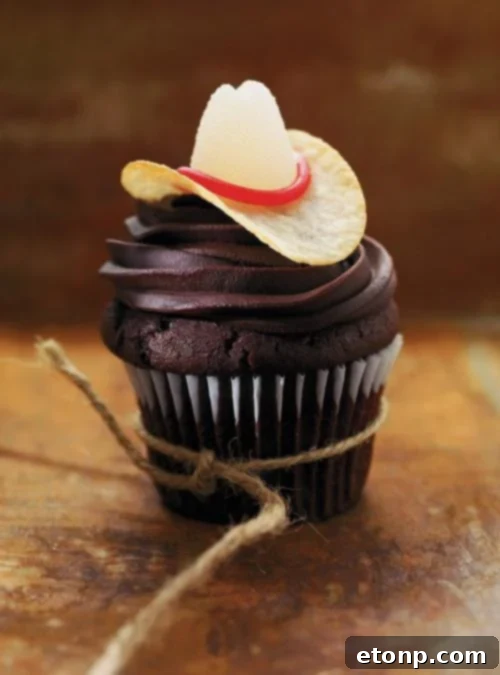 Rustic cowboy-themed cupcakes decorated with fondant cowboy hats and bandanas, perfect for a Western party.
