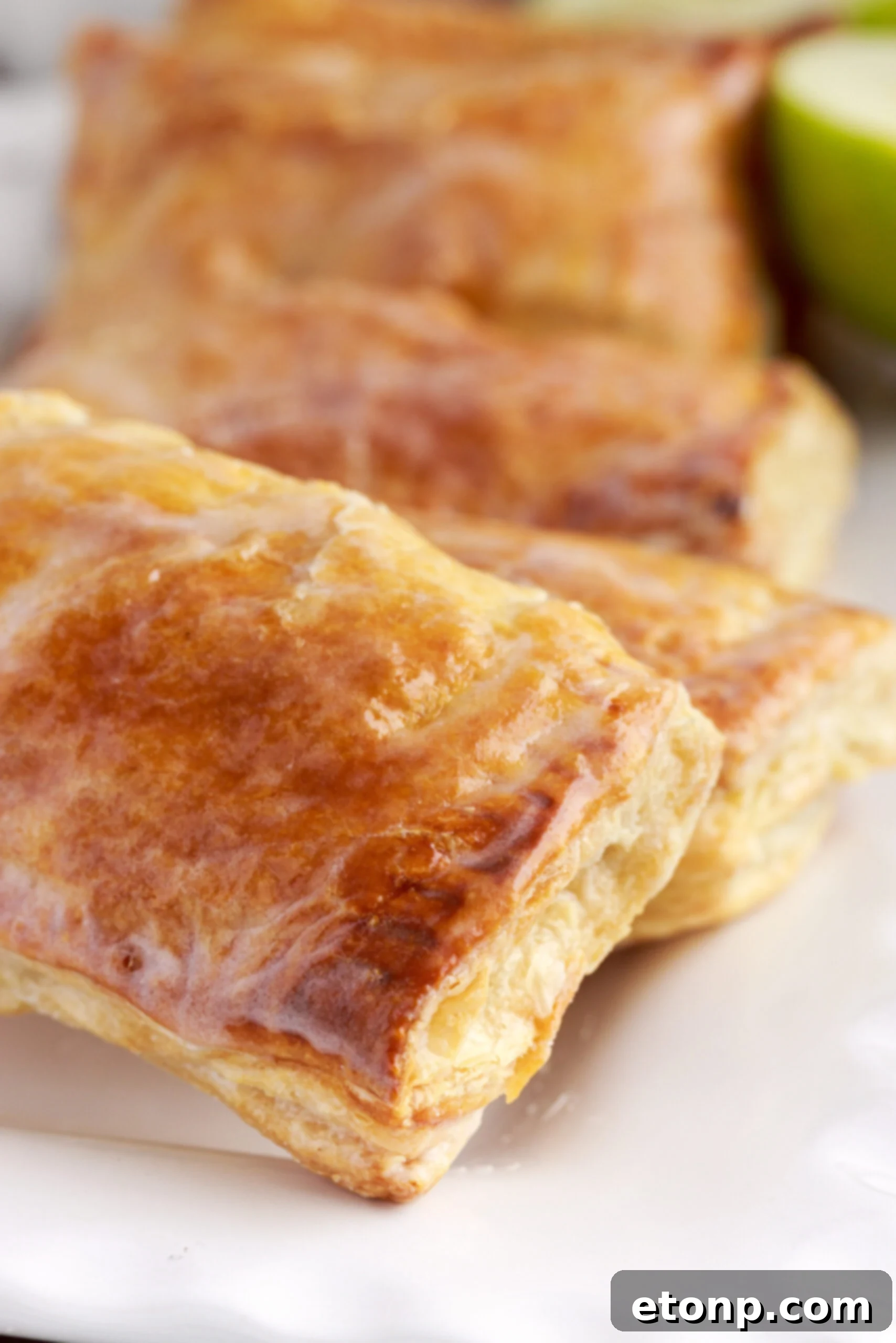 A vibrant flat lay showcasing all the fresh and measured ingredients required to bake these delicious apple hand pies.
