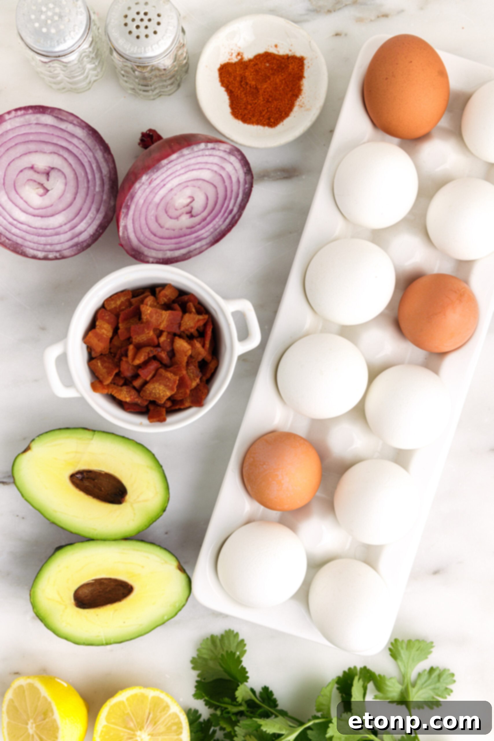 Overhead view of ingredients needed to make avocado deviled eggs. 