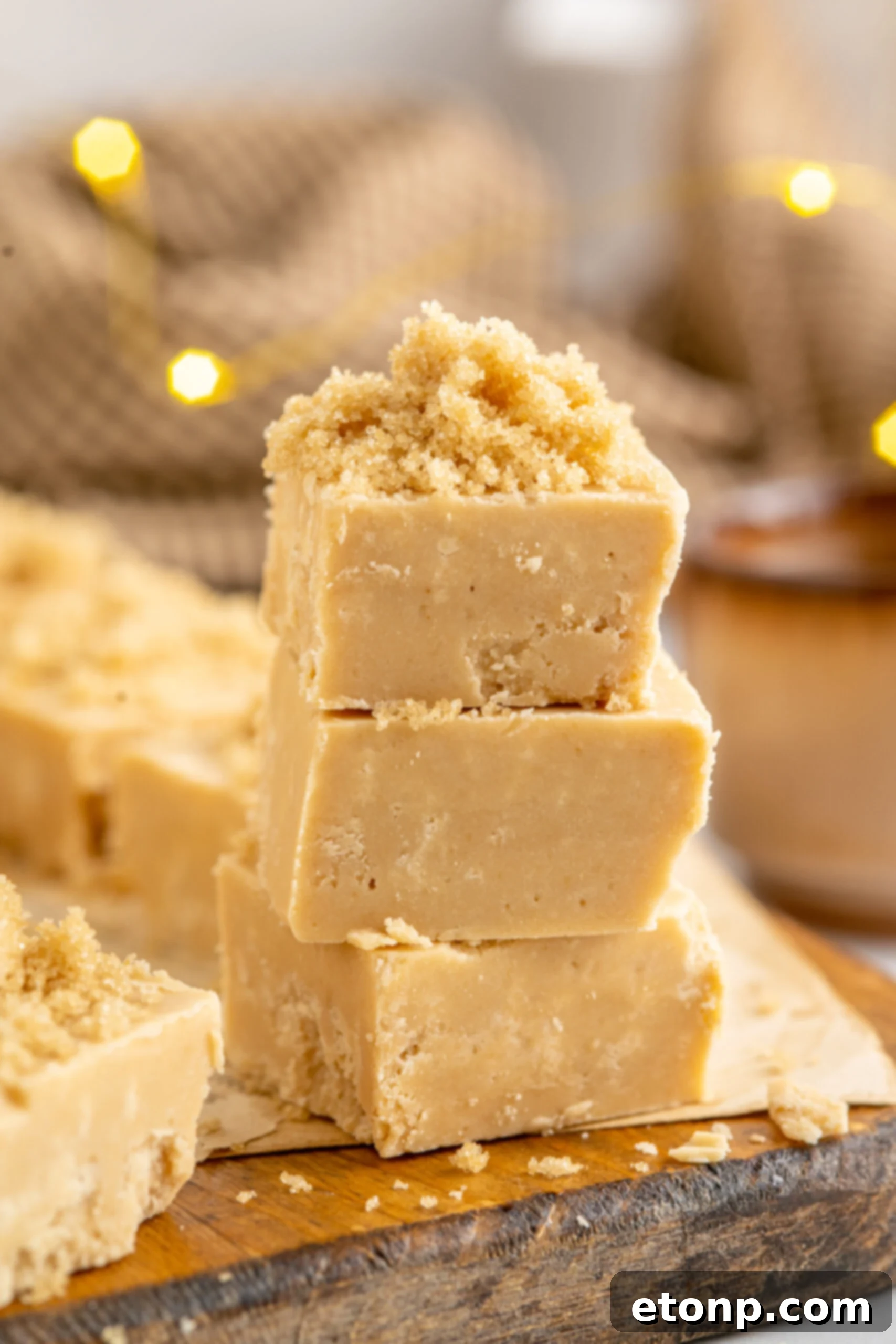 Golden Caramel Fudge 2 Side view of three pieces of Penuche Fudge stacked.