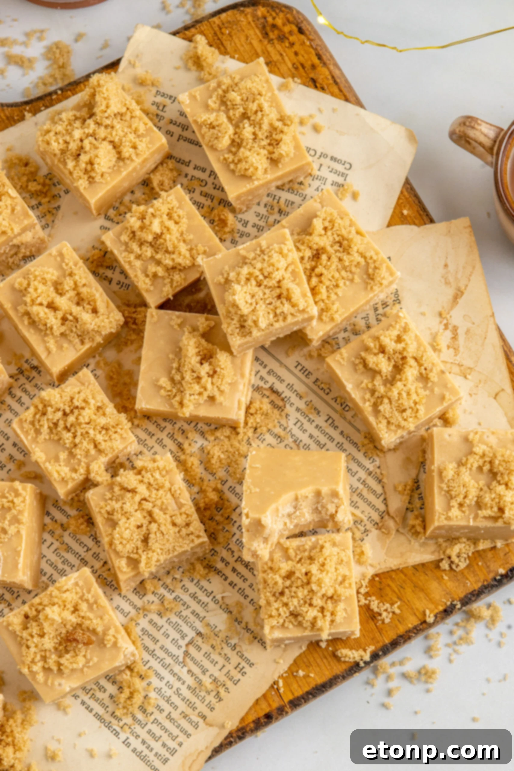 Golden Caramel Fudge 13 Overhead view of Penuche Fudge on a wooden board.