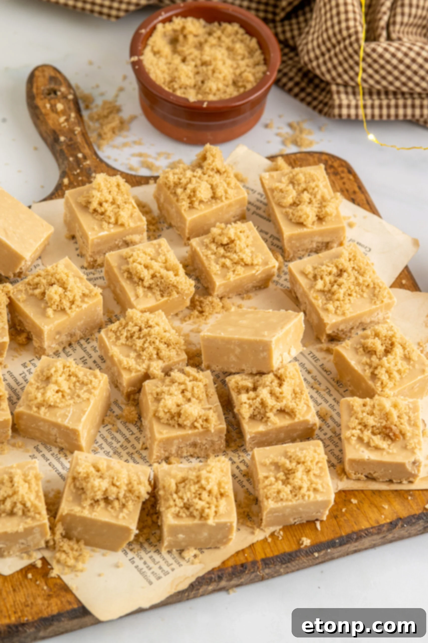 Golden Caramel Fudge 16 Overhead view of Penuche Fudge on a wooden board.