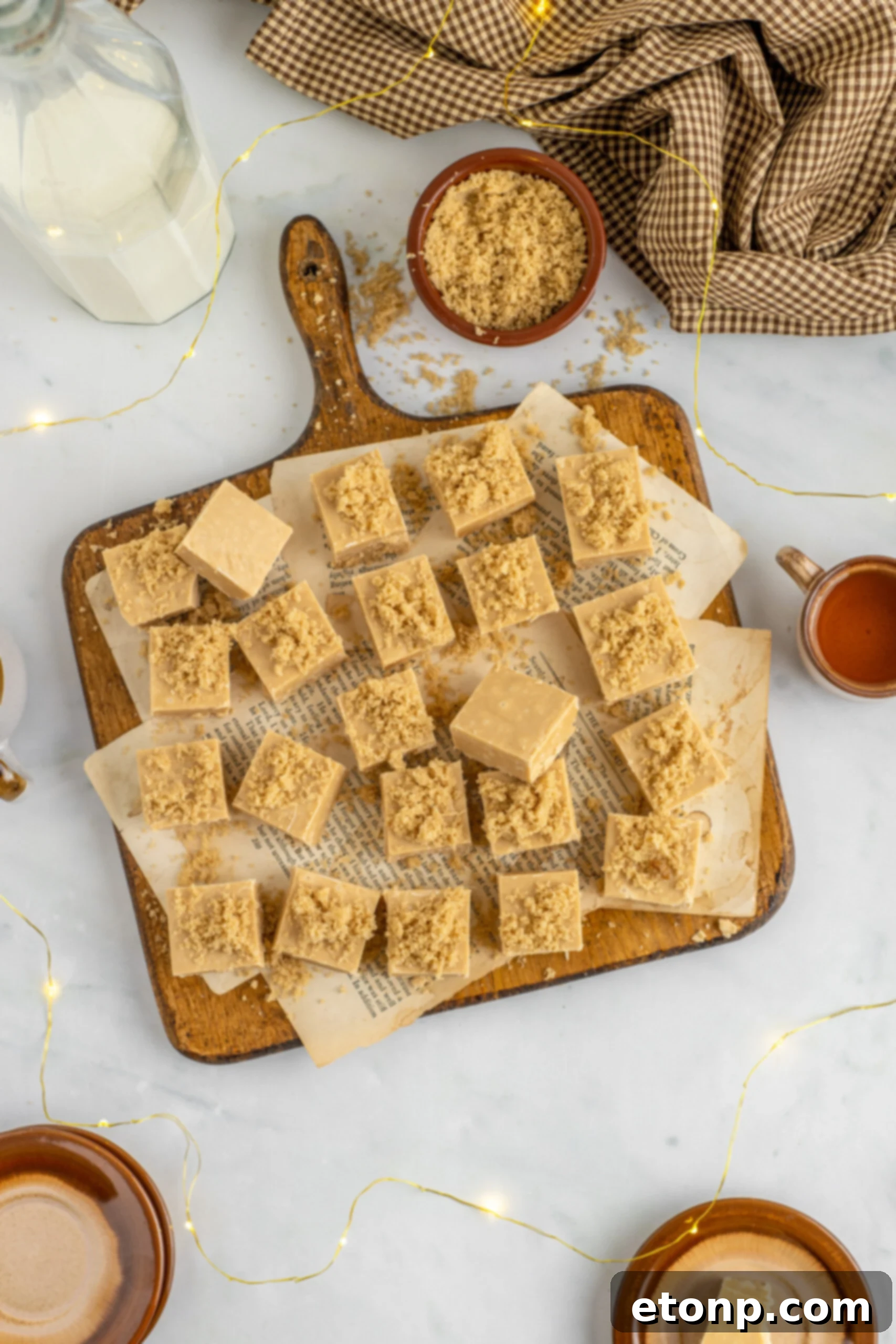 Golden Caramel Fudge 3 Overhead view of Penuche Fudge on a wooden board.
