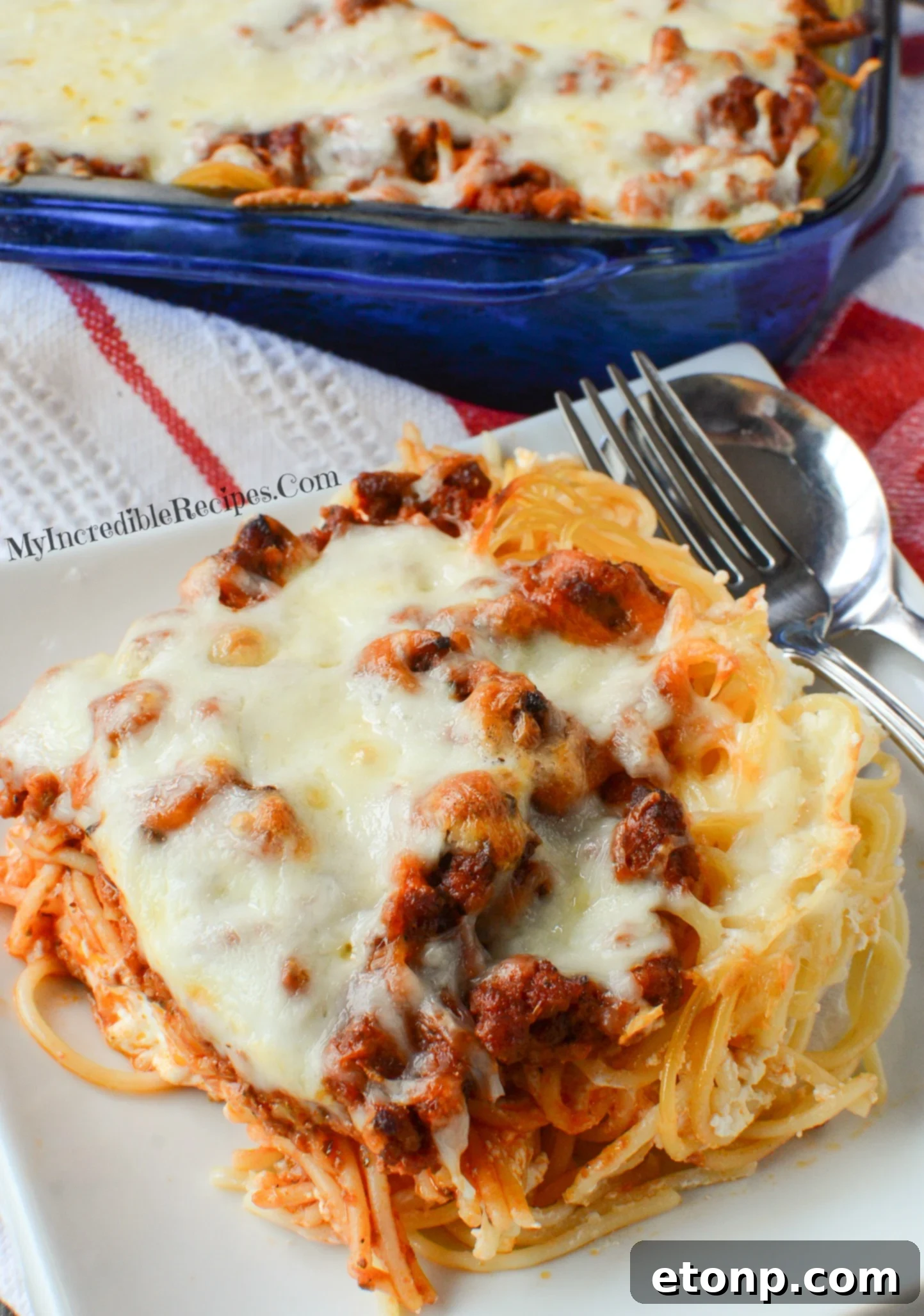 Crown Jewel Spaghetti 11 Million Dollar Spaghetti casserole topped with cheese and ready for baking