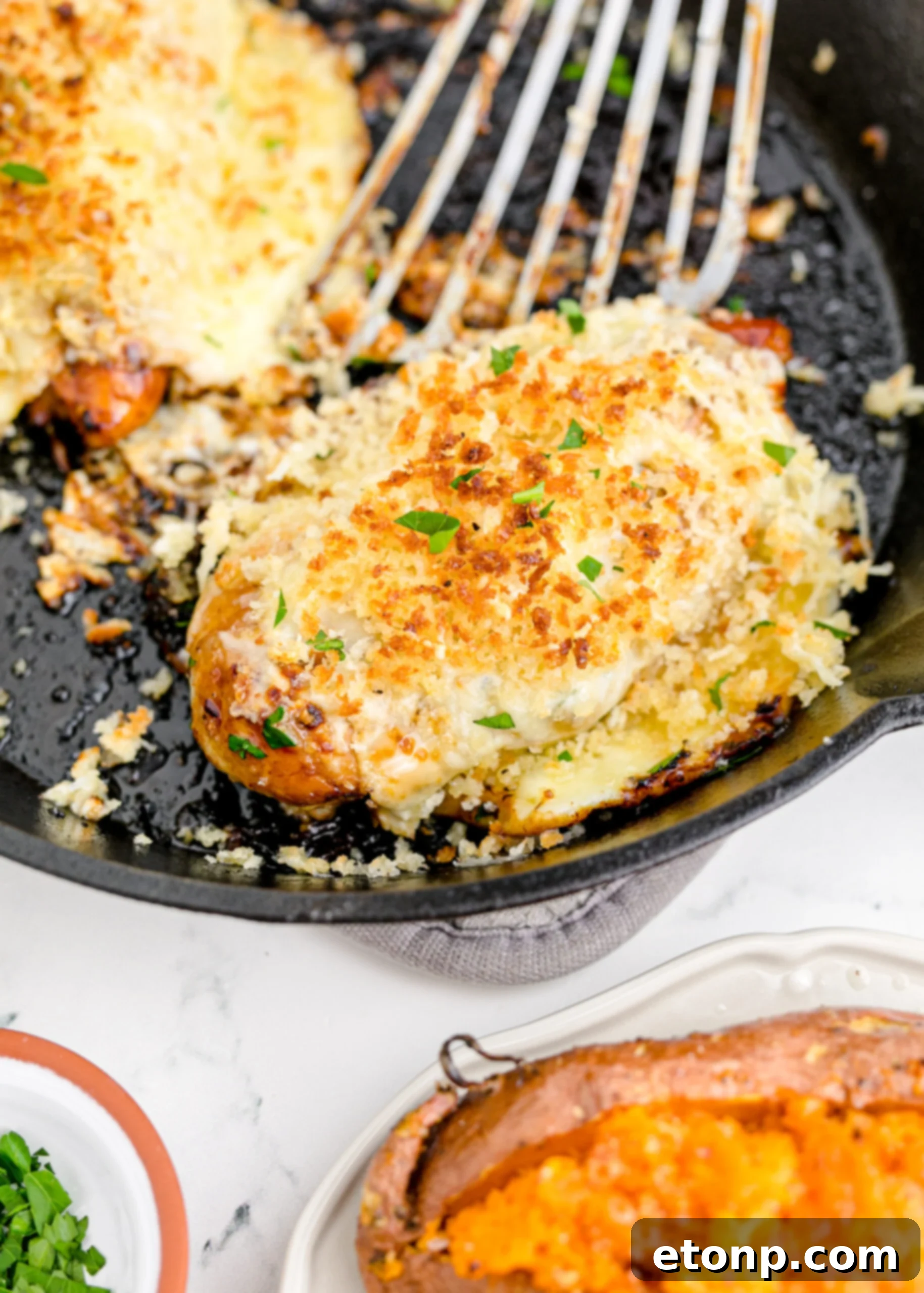 Crispy Parmesan Chicken 5 Parmesan Crusted Chicken (Longhorn Copycat) sizzling in a cast iron skillet.