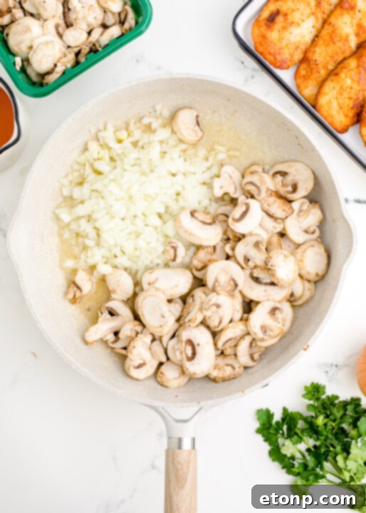 Ingredients being added to a pan for Chicken Marsala