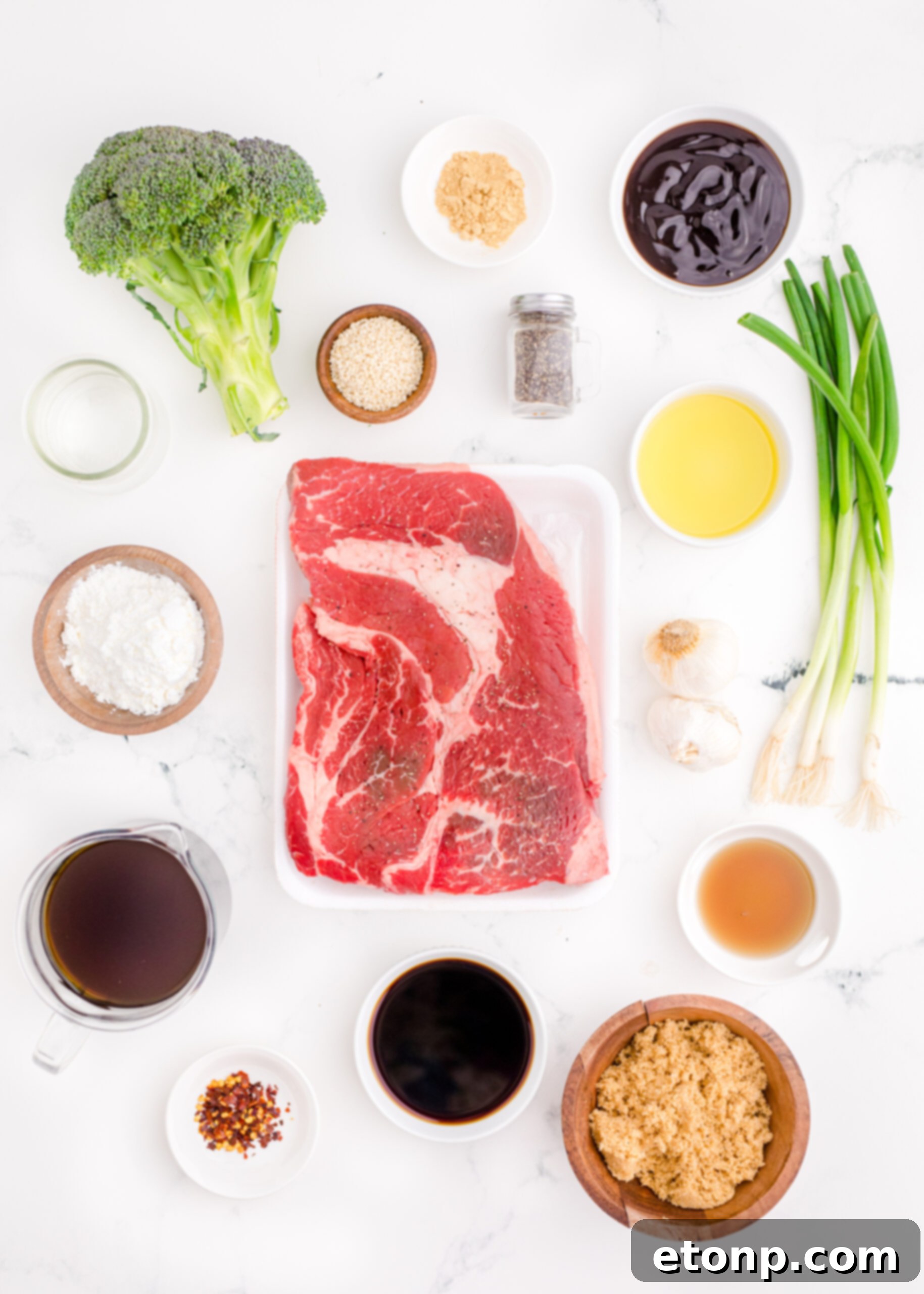 An overhead shot showcasing all the fresh and savory ingredients meticulously laid out, ready to be used for making Instant Pot Beef and Broccoli.