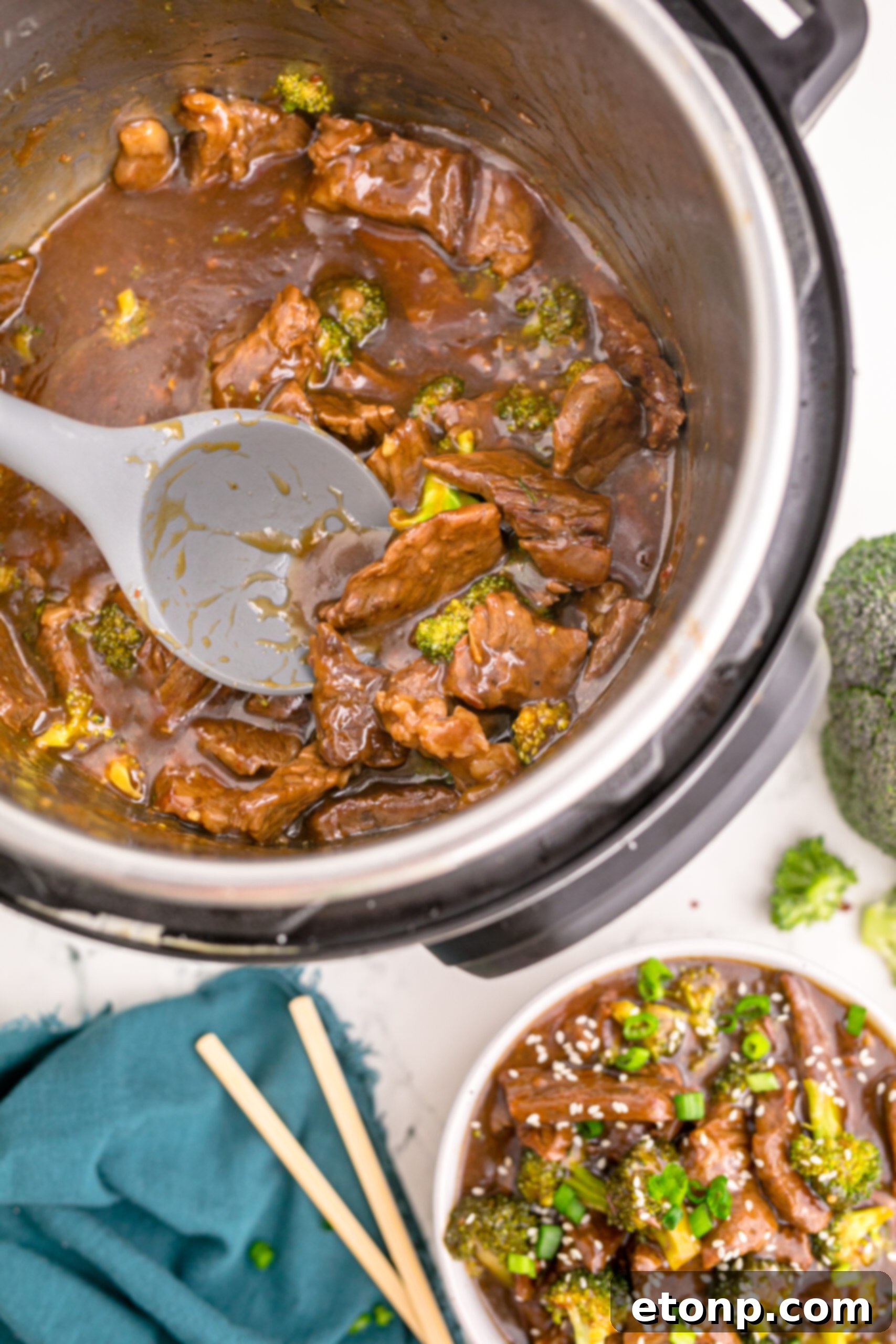 Overhead view of Instant Pot Beef and Broccoli nestled comfortably inside the Instant Pot, showing the freshly cooked meal.