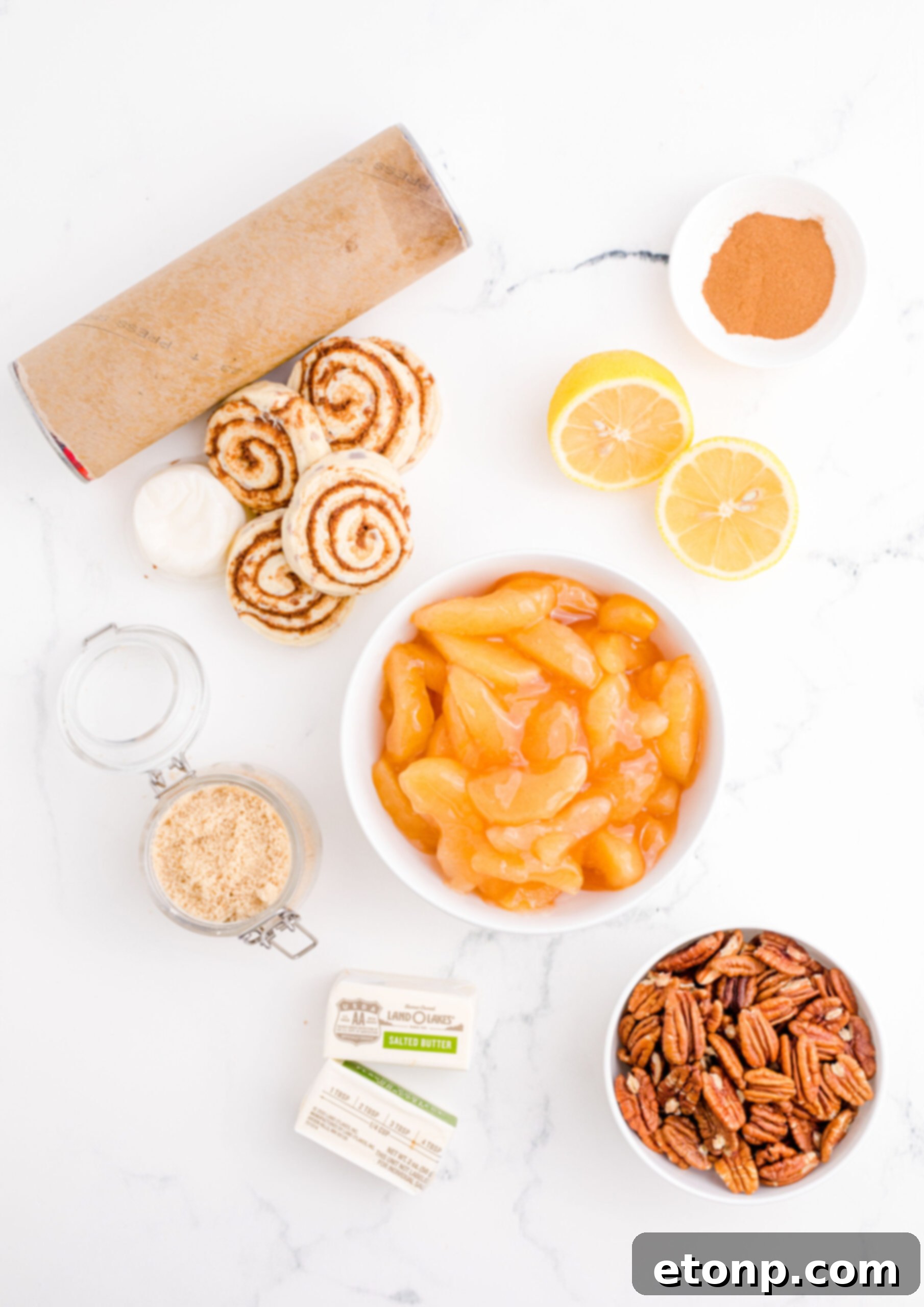 An overhead view captures all the fresh ingredients meticulously laid out, ready for the Cinnamon Roll Casserole recipe.