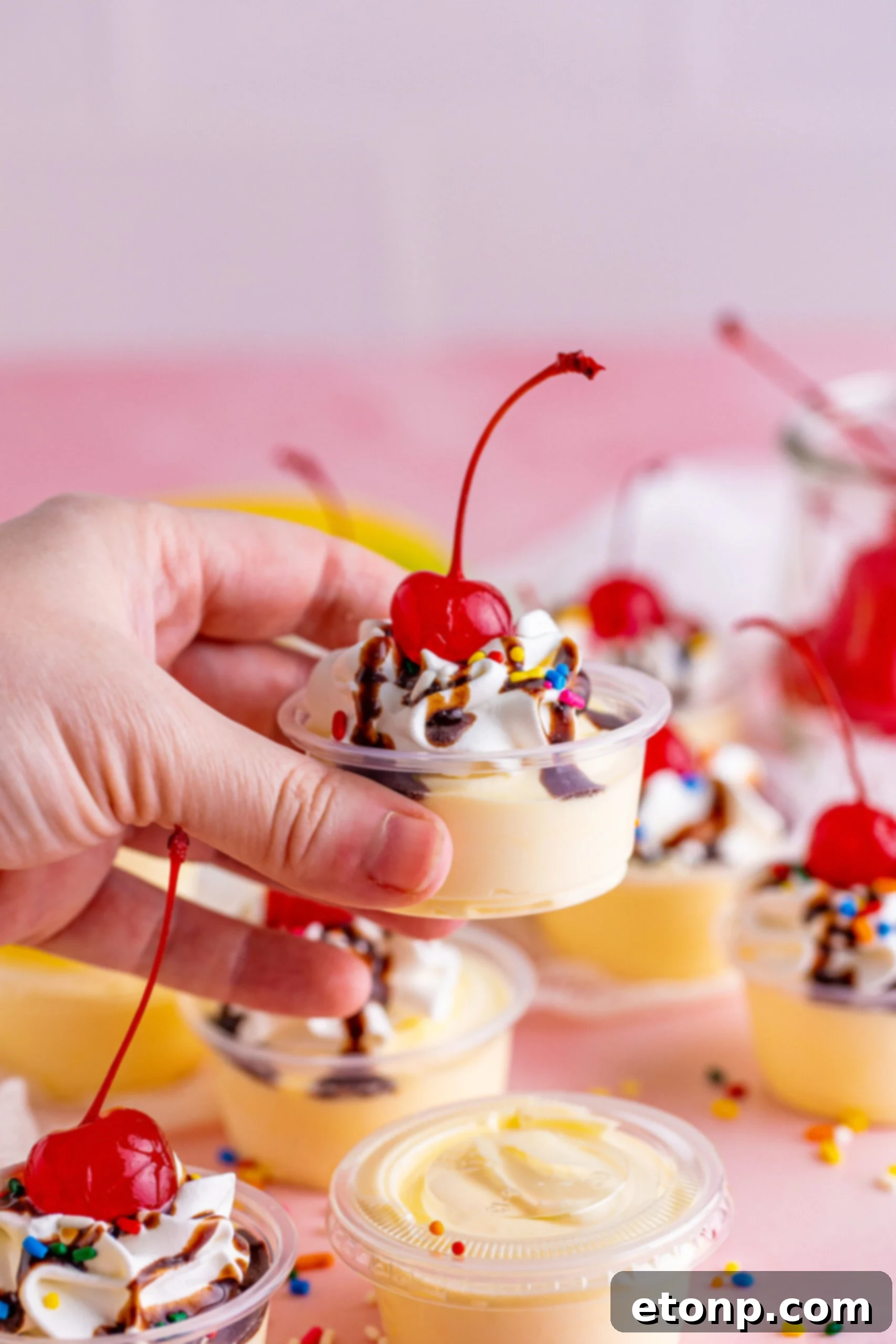 Side view of Banana Split Shots being held.
