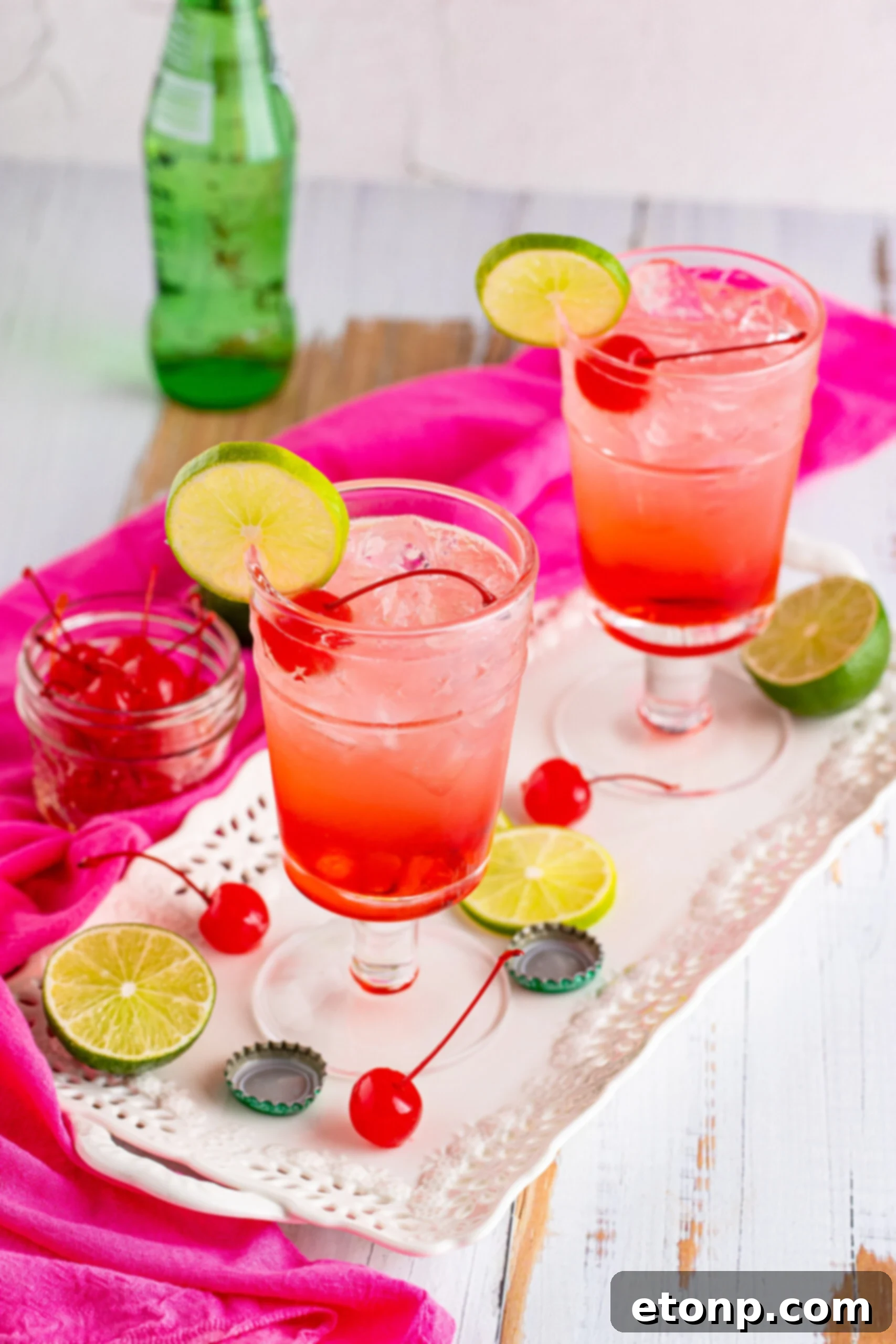 View of Dirty Shirley Temple garnished with a lime slice.
