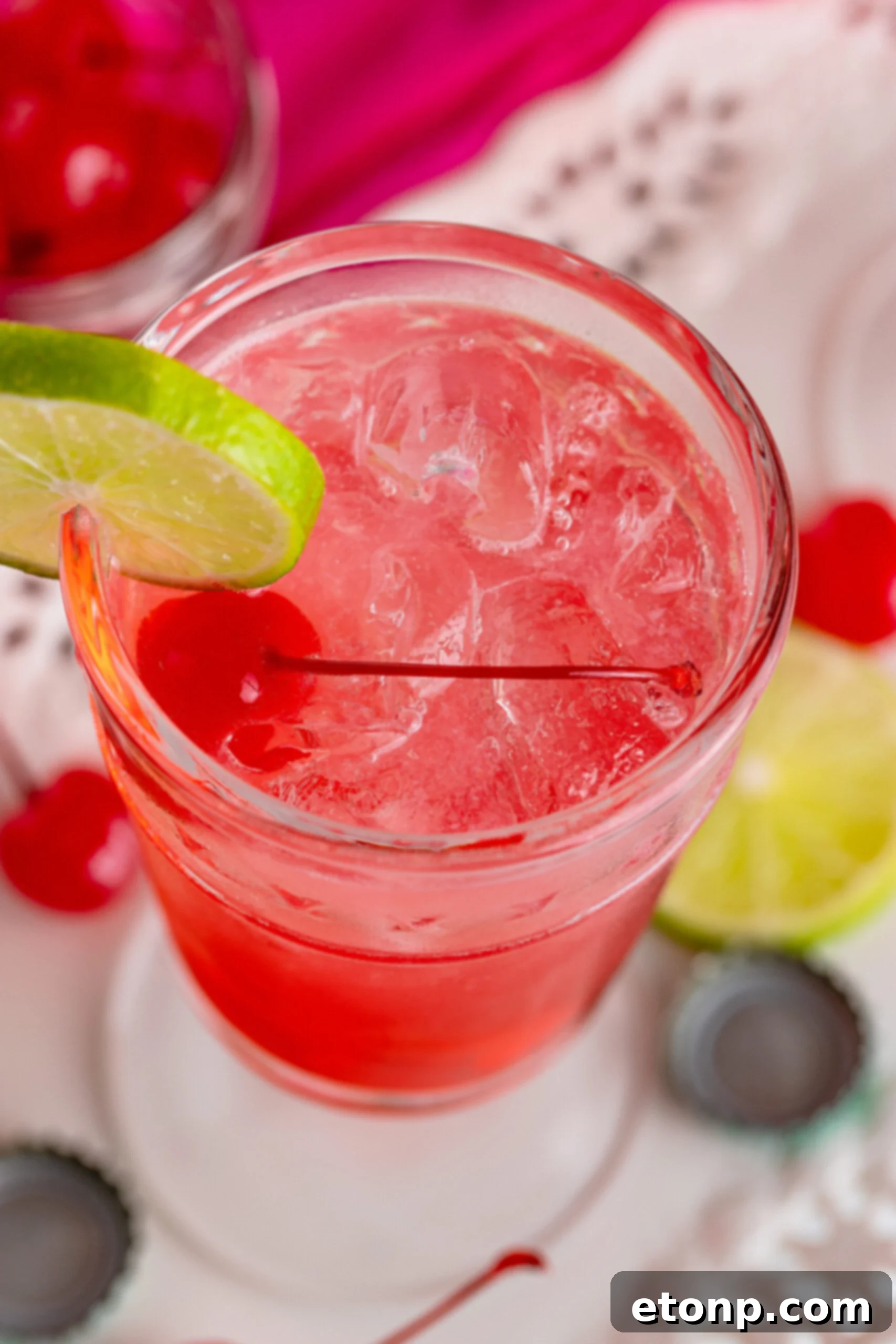 Overhead view of Dirty Shirley Temple garnished with a lime slice.