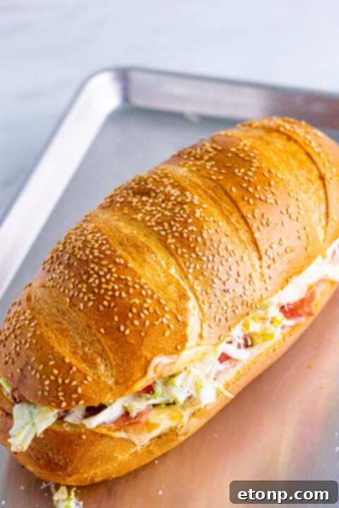 Toasted Grinders 13 A freshly assembled Grinder Sub, sliced into perfect portions, revealing all the delicious layers inside.