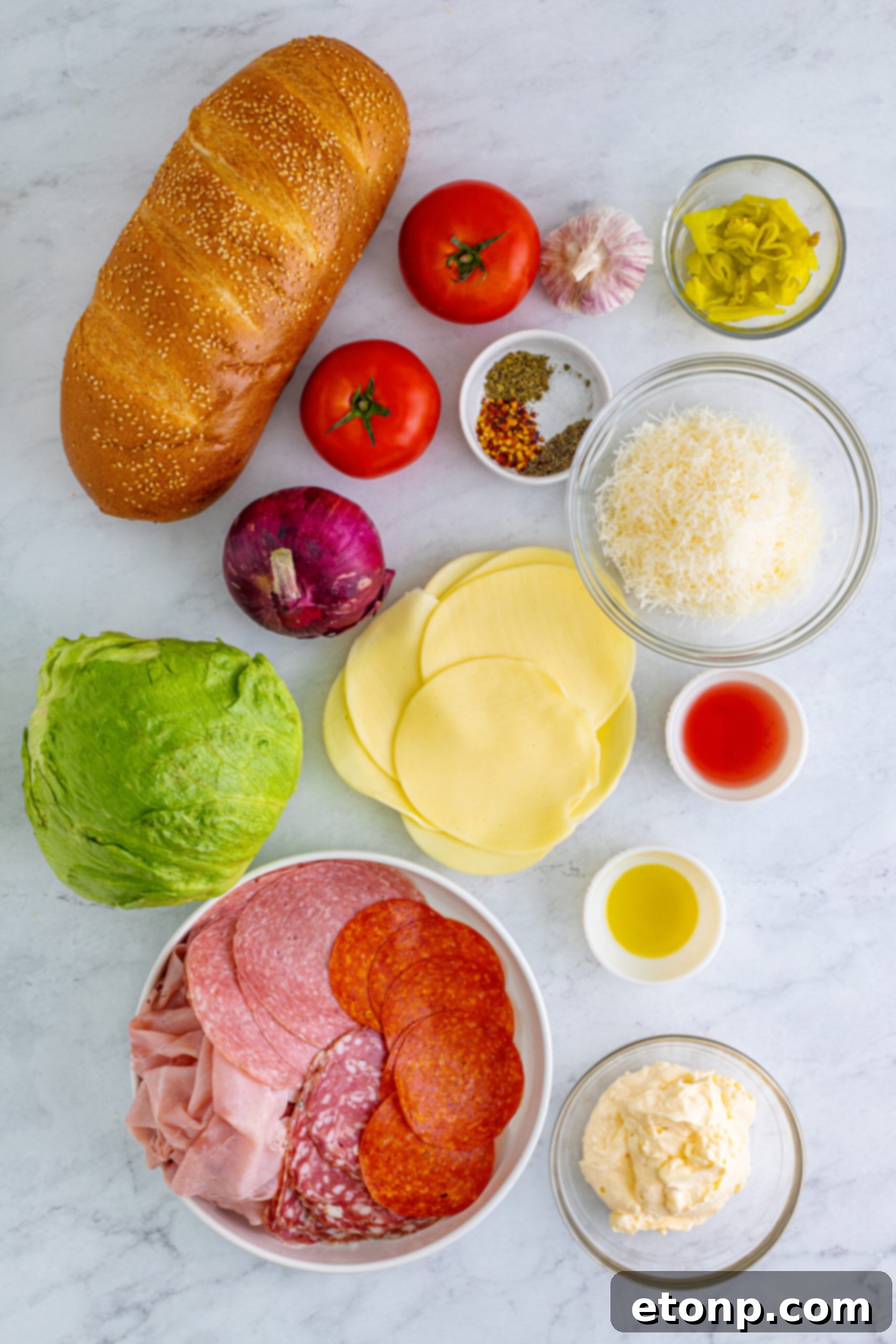 Toasted Grinders 7 Overhead view of all fresh and deli ingredients neatly arranged for making the ultimate Grinder Subs recipe.