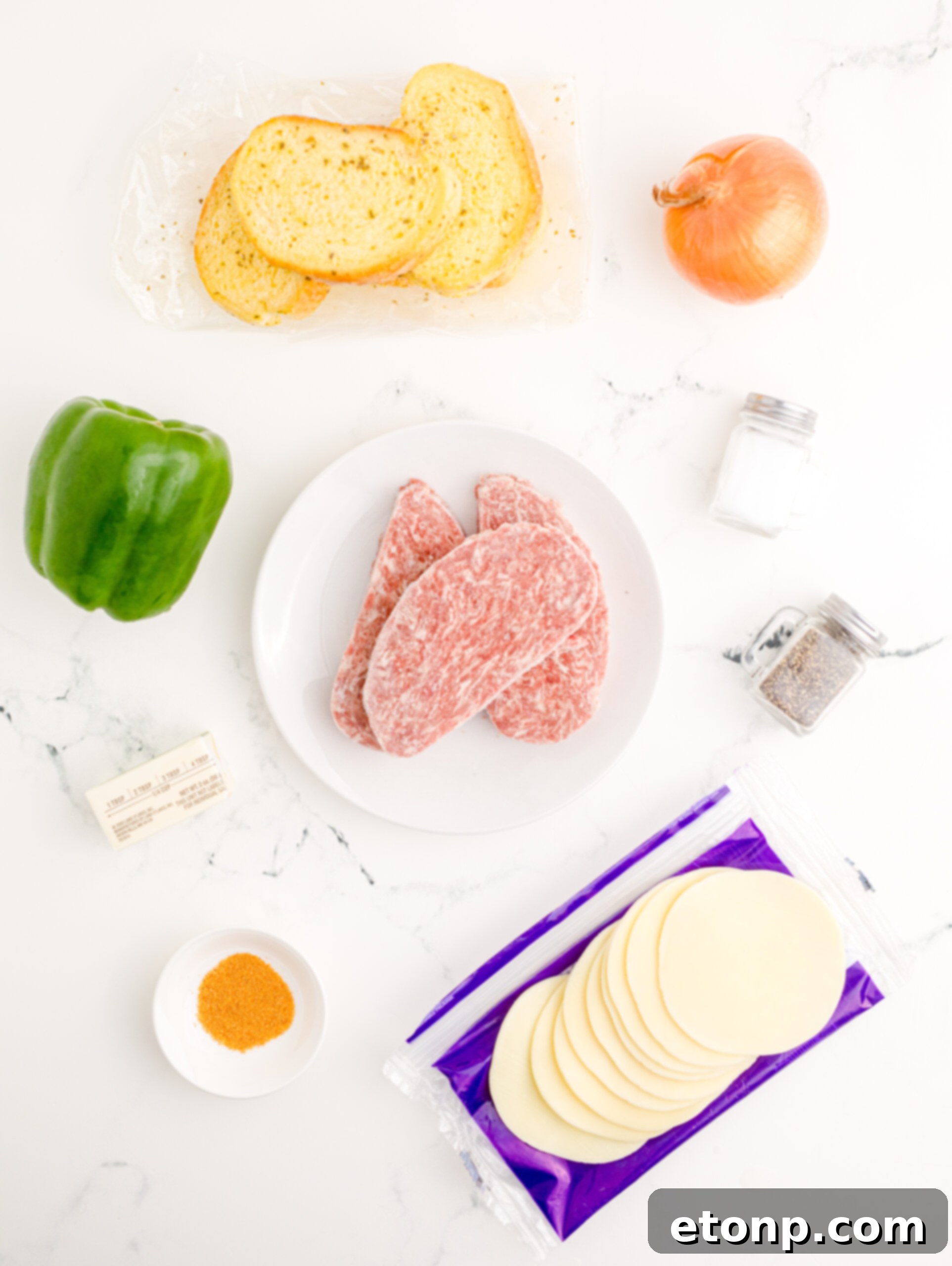 Crispy Air Fryer Philly Cheesesteaks 6 Overhead view of the ingredients needed to complete this recipe.