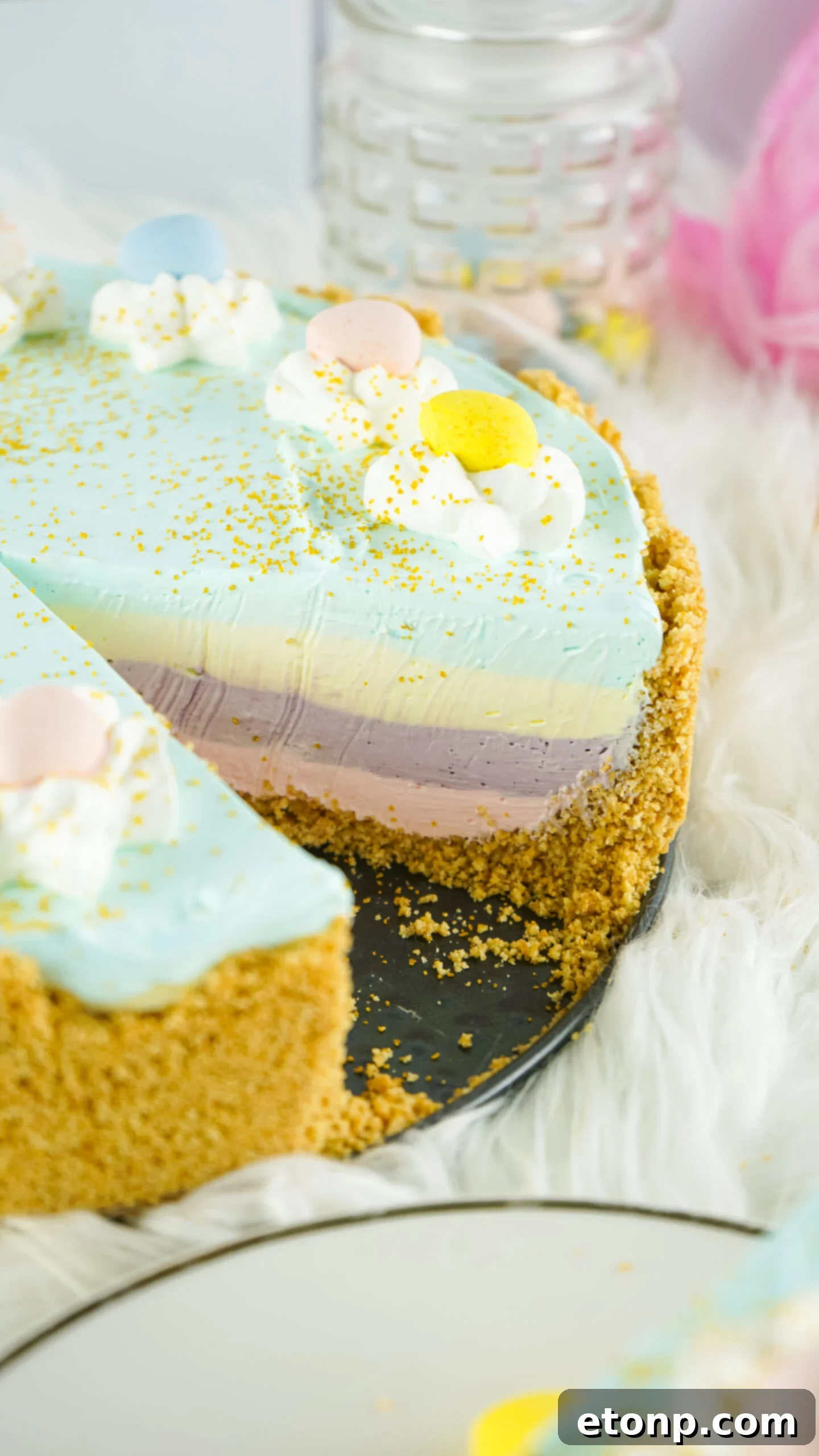 Close up view view of Easter Kool Aid Pie with a slice removed.