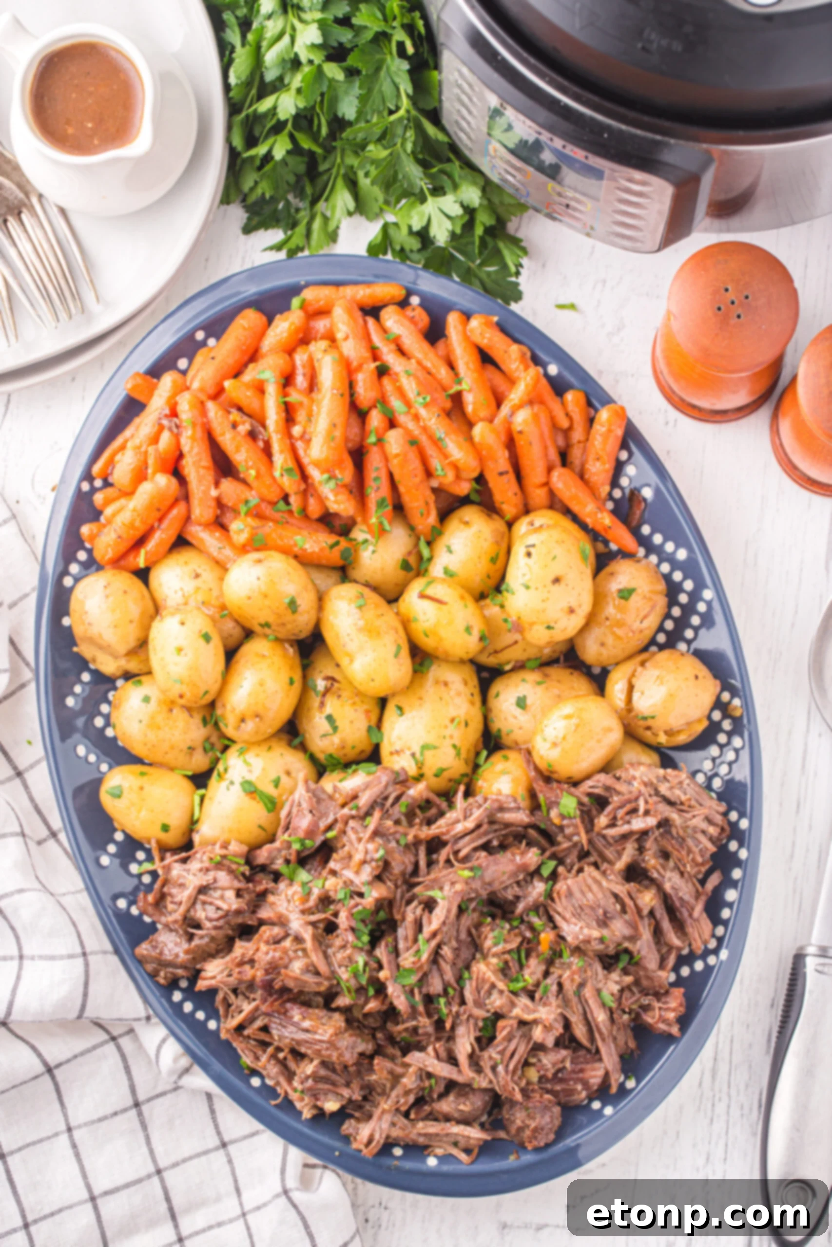 Overhead view of the finished pot roast, potatoes, and carrots. 