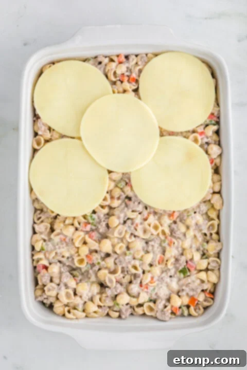 Philly Cheesesteak Casserole served with a side of dipping sauce.