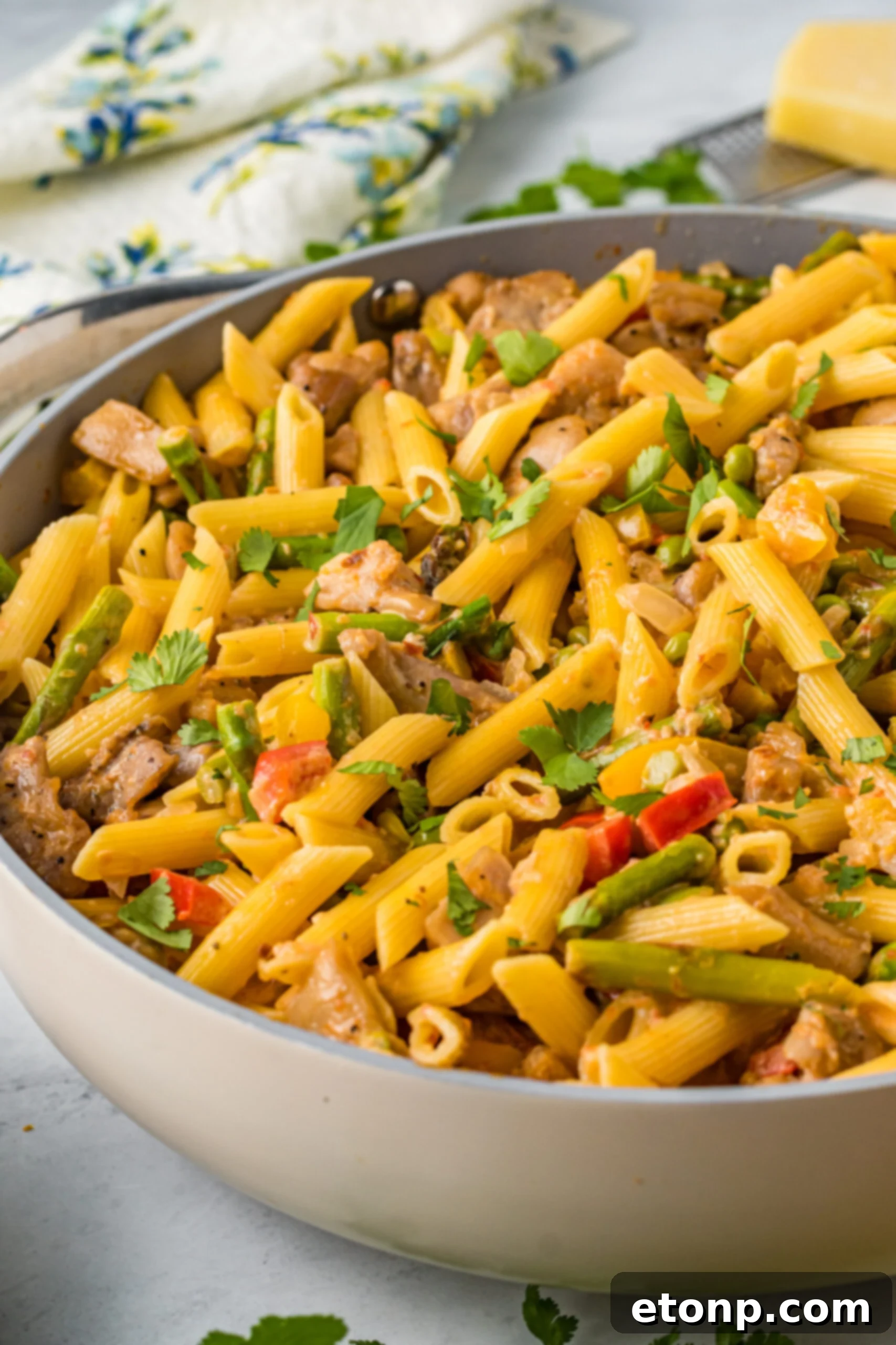 Side view of Cajun Chicken Pasta in a frying pan.