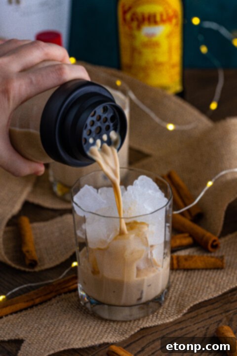 Step 1: Fill a cocktail shaker with ice.