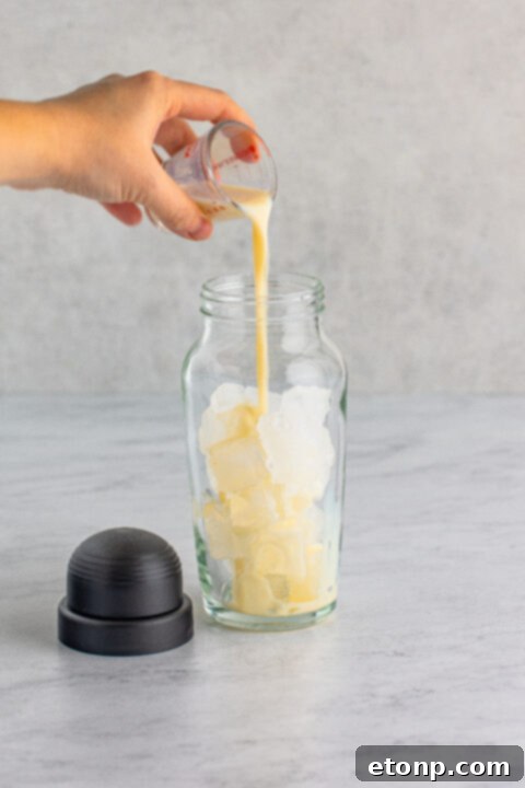 Step 2: Add RumChata to the shaker.