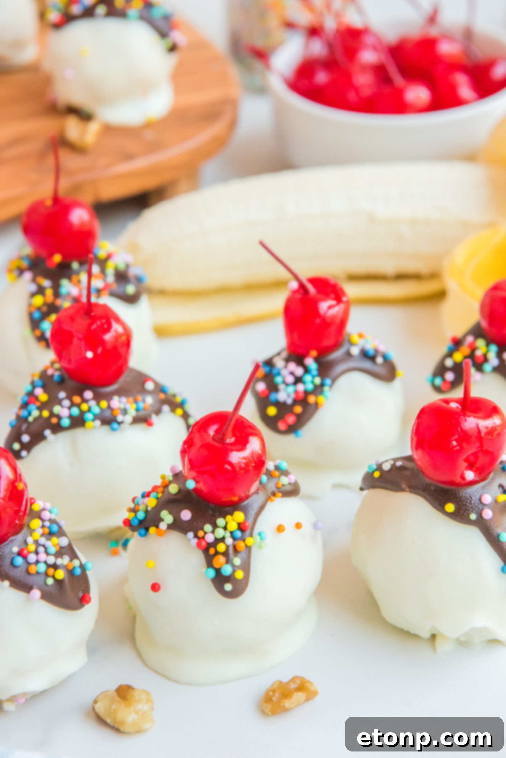 Front view of Banana Truffles surrounded by nuts.