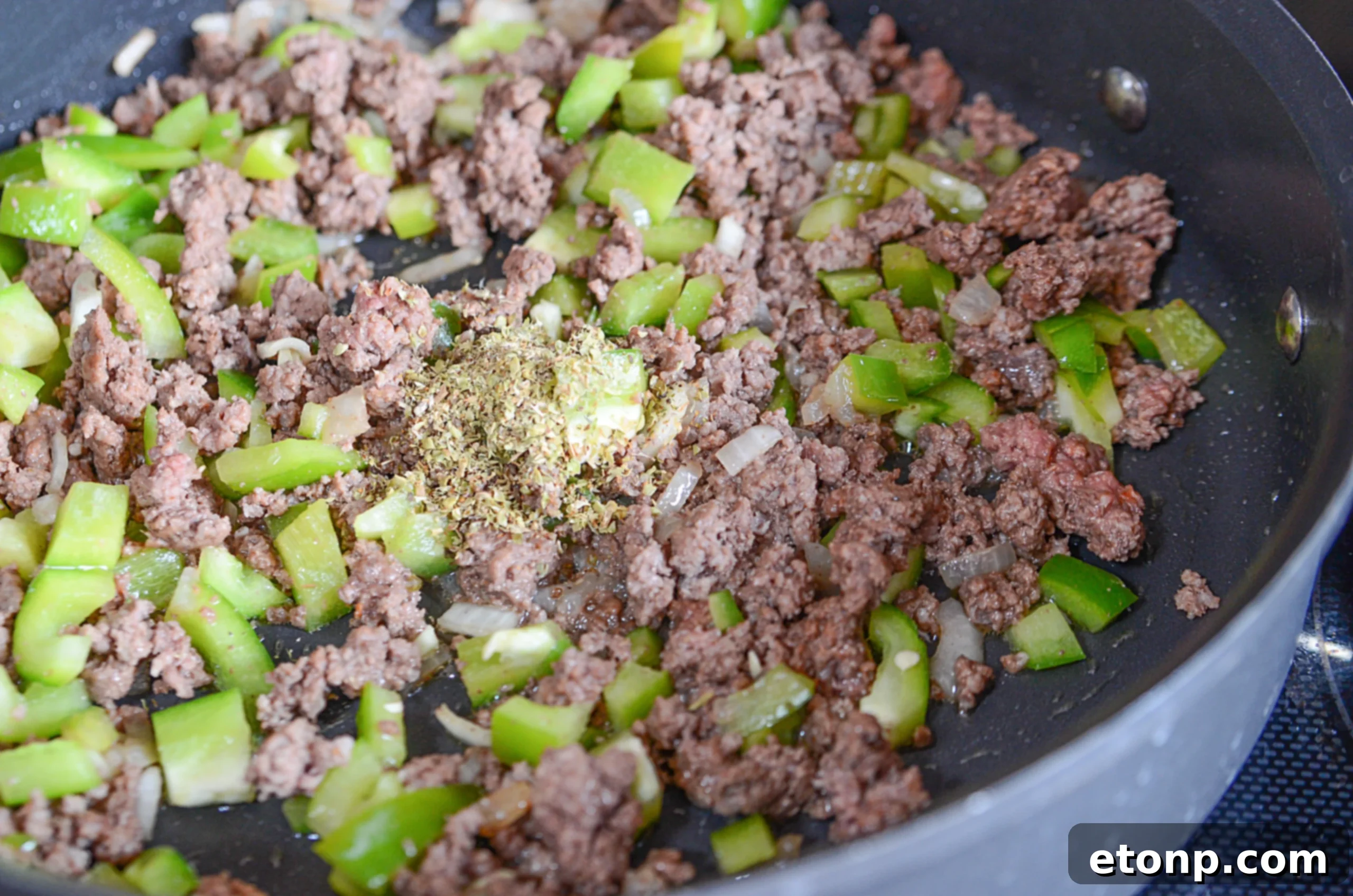 Nana's Classic American Chop Suey 4 Freshly diced green, red, and yellow bell peppers for American Chop Suey