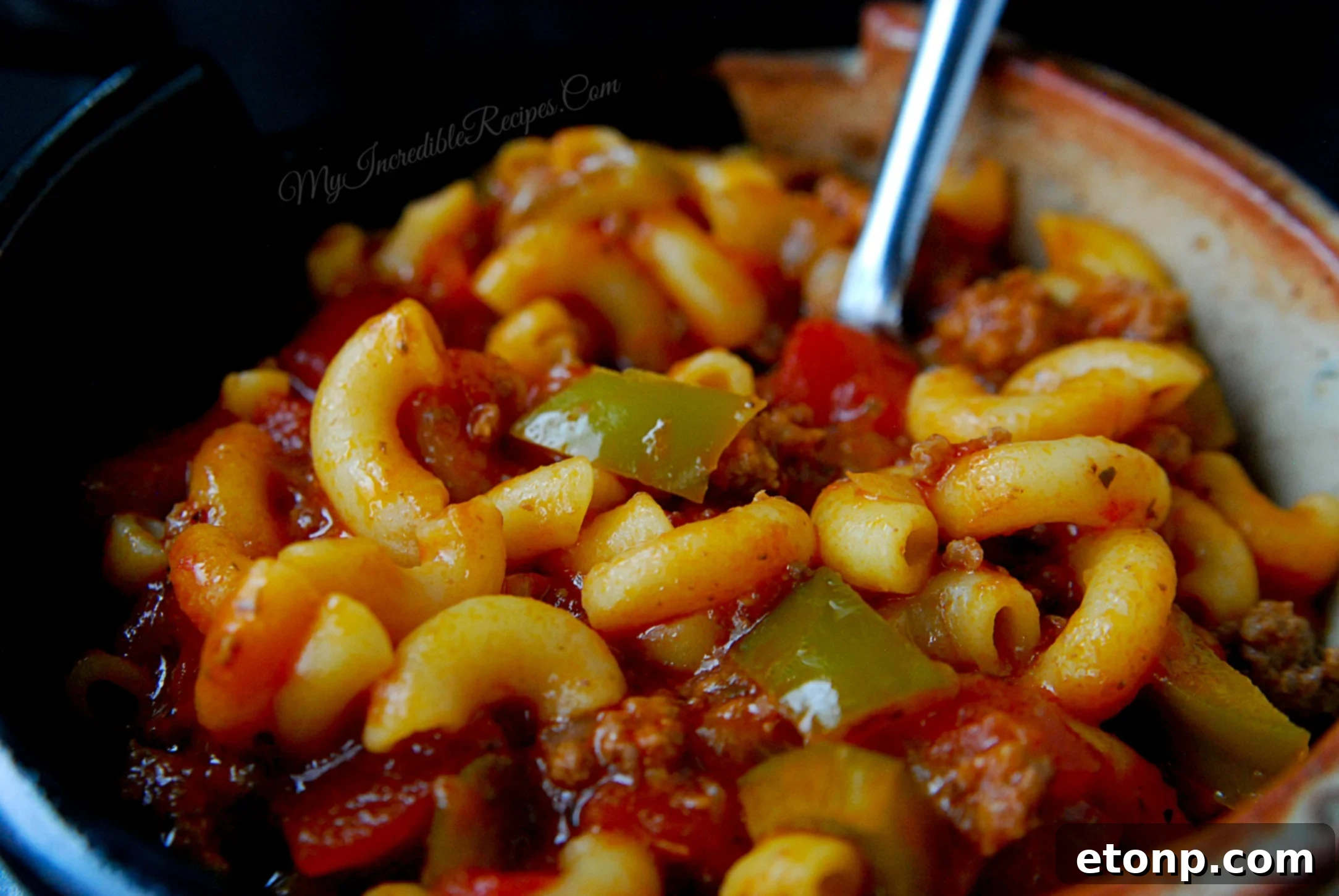 Nana's Classic American Chop Suey 9 Ground beef browning in a skillet with vegetables