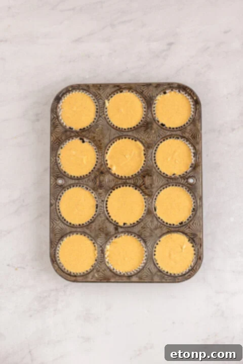 A bowl of spices and pumpkin puree, essential for the cheesecake filling.