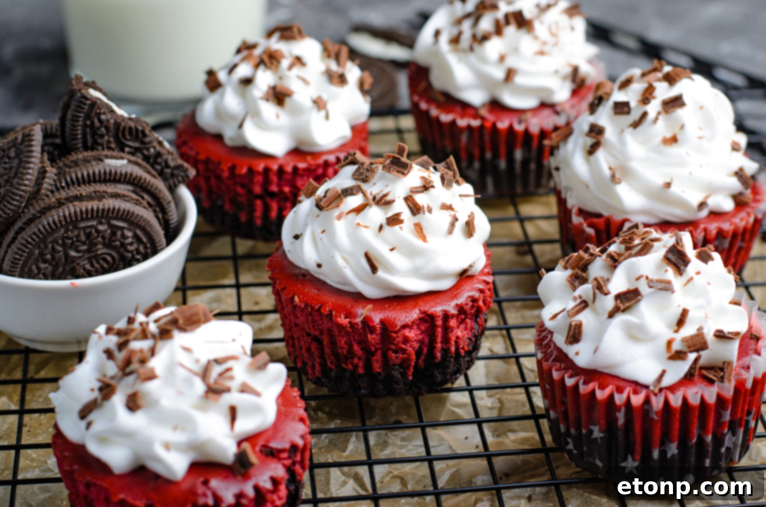  Mini Red Velvet Oreo Cheesecakes on a wire rack 