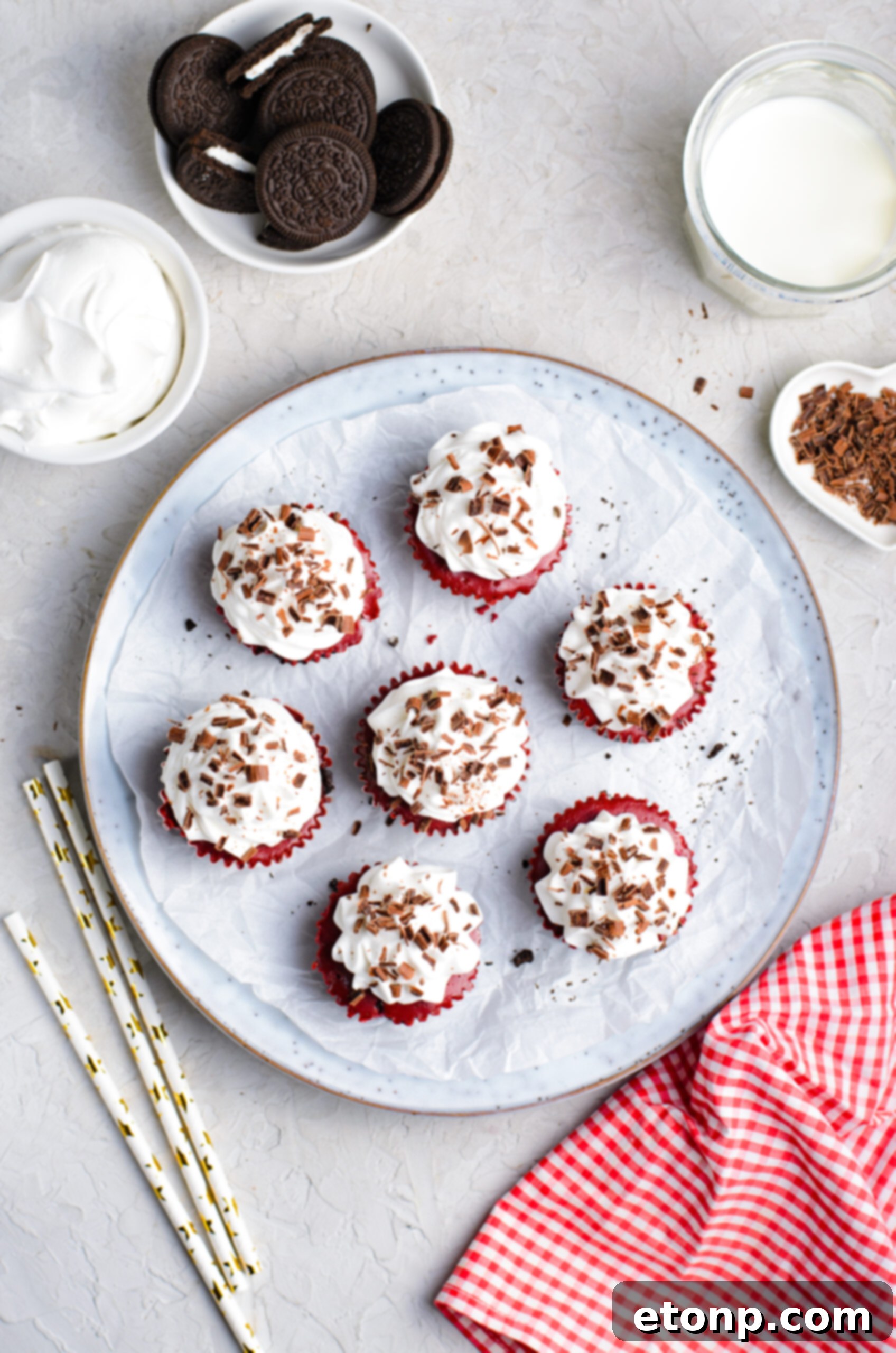 Overhead view of Mini Red Velvet Oreo Cheesecakes on a dish.